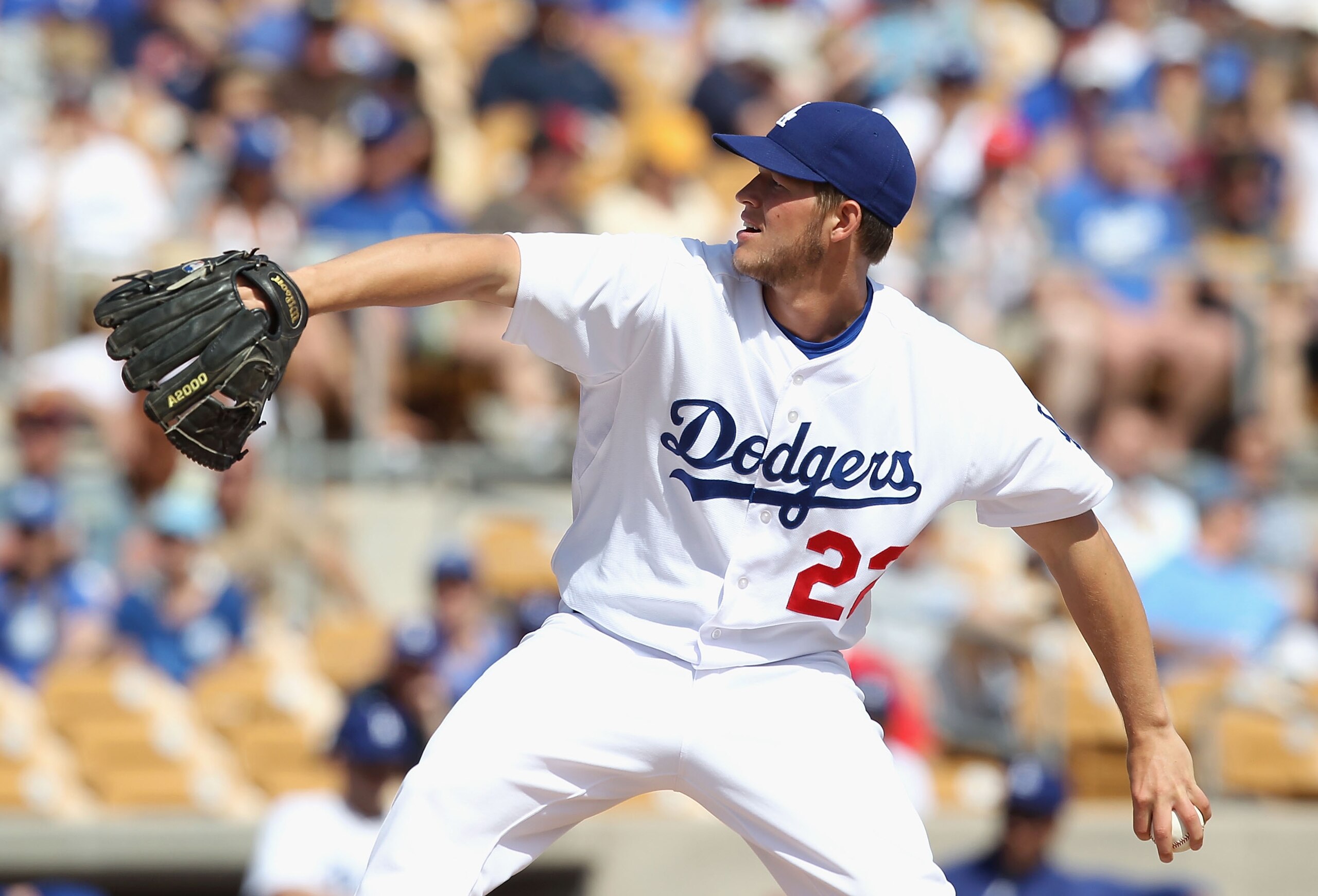 GLENDALE, AZ - MARCH 05:  Starting pitcher Clayton Kershaw #22 of the Los Angeles Dodgers pitches against the Cincinnati Reds during the spring training game at Camelback Ranch on March 5, 2011 in Glendale, Arizona.  (Photo by Christian Petersen/Getty Ima