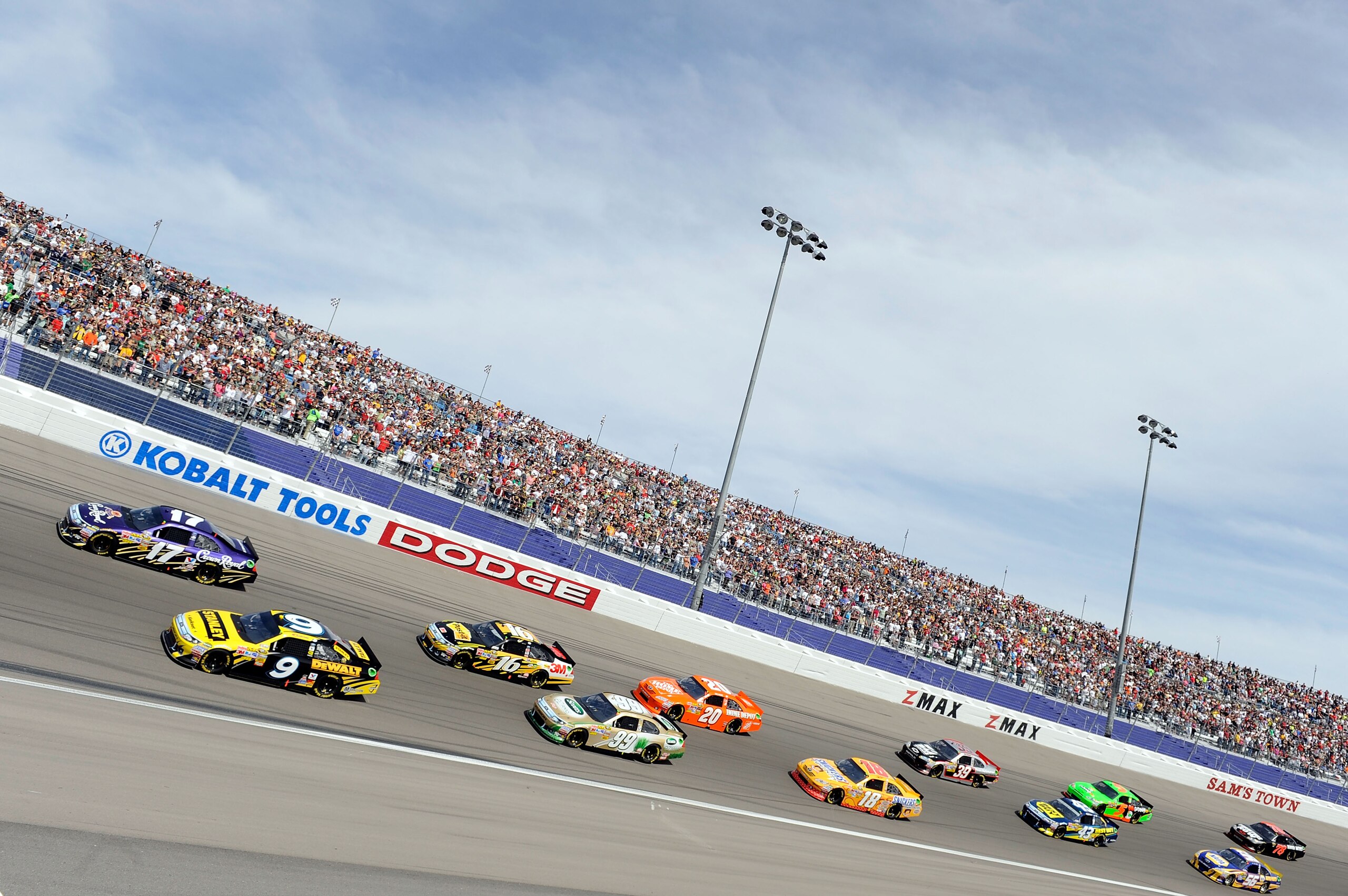 LAS VEGAS, NV - MARCH 06:  Matt Kenseth, driver of the #17 Crown Royal Ford, and Marcos Ambrose, driver of the #9 Stanley Ford,  lead the field during the NASCAR Sprint Cup Series Kobalt Tools 400 at Las Vegas Motor Speedway on March 6, 2011 in Las Vegas,