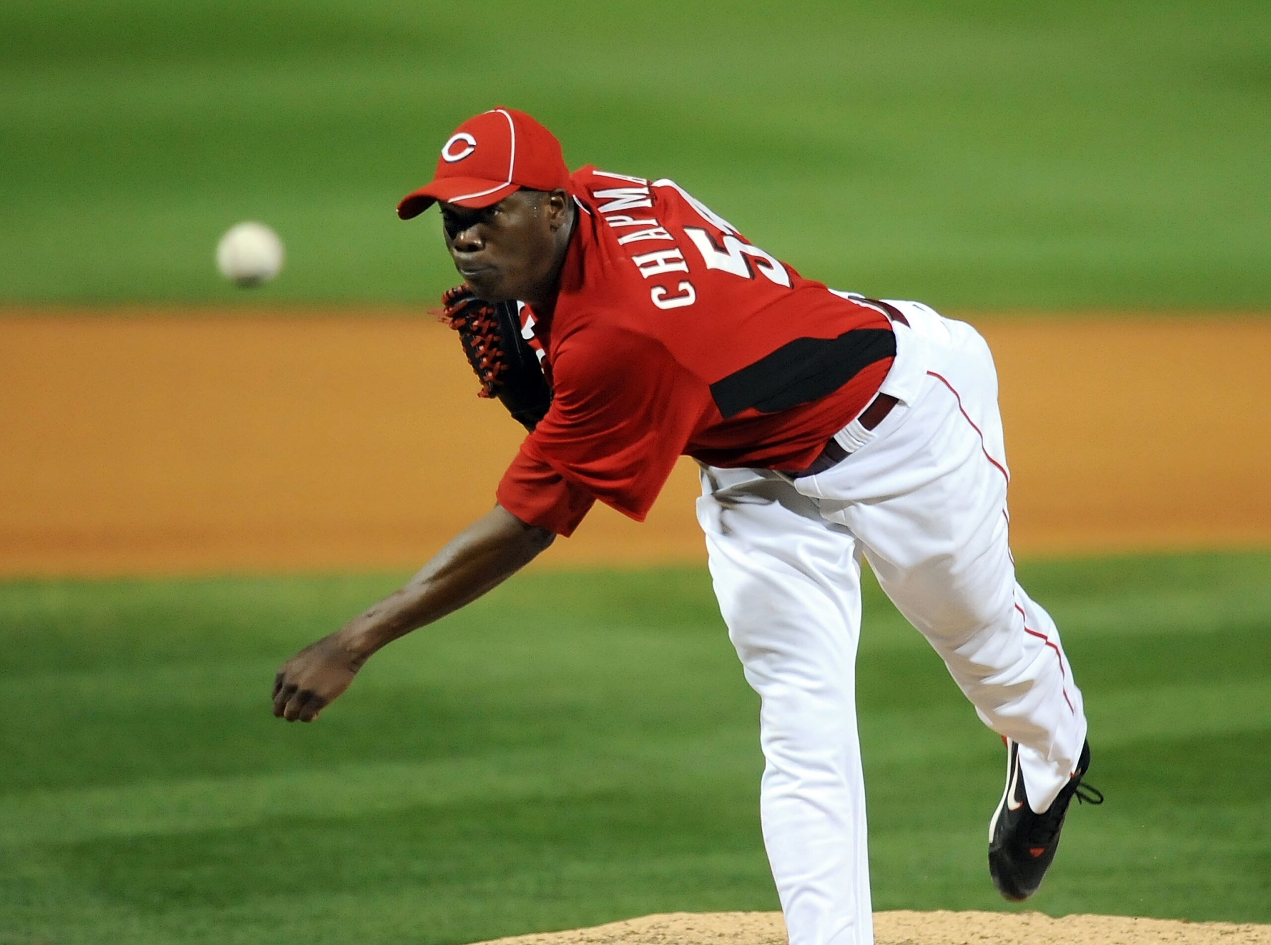 GOODYEAR, AZ - MARCH 03:  Aroldis Chapman #54 of the Cincinnati Reds delivers a pitch against the Los Angeles Dodgers at Goodyear Ballpark on March 3, 2011 in Goodyear, Arizona.  (Photo by Norm Hall/Getty Images)