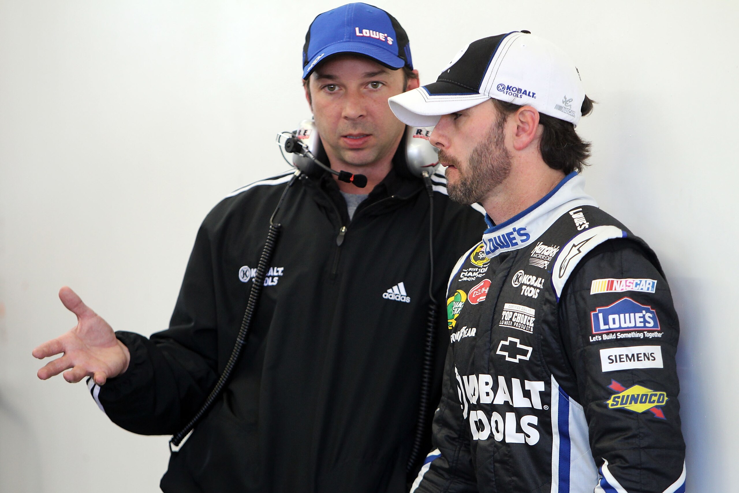 LAS VEGAS, NV - MARCH 04:  Crew chief Chad Knaus (L) talks with Jimmie Johnson, driver of the #48 Lowe's/Kobalt Tools Chevrolet, in the garage area during practice for the NASCAR Sprint Cup Series Kobalt Tools 400 at Las Vegas Motor Speedway on March 4, 2