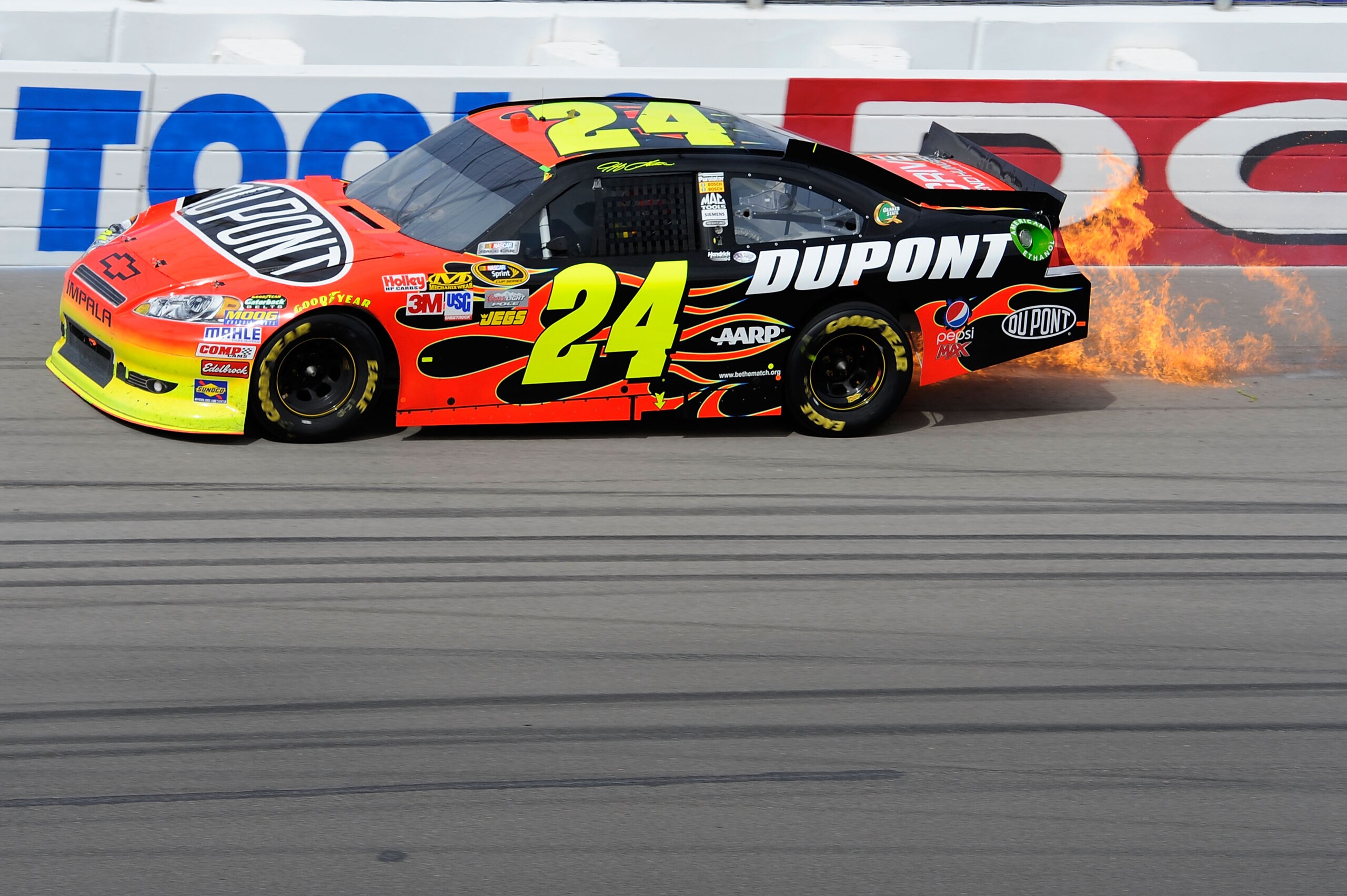 LAS VEGAS, NV - MARCH 06:  Jeff Gordon, driver of the #24 DuPont Chevrolet, hits the wall after cutting a tire in the NASCAR Sprint Cup Series Kobalt Tools 400 at Las Vegas Motor Speedway on March 6, 2011 in Las Vegas, Nevada.  (Photo by John Harrelson/Ge