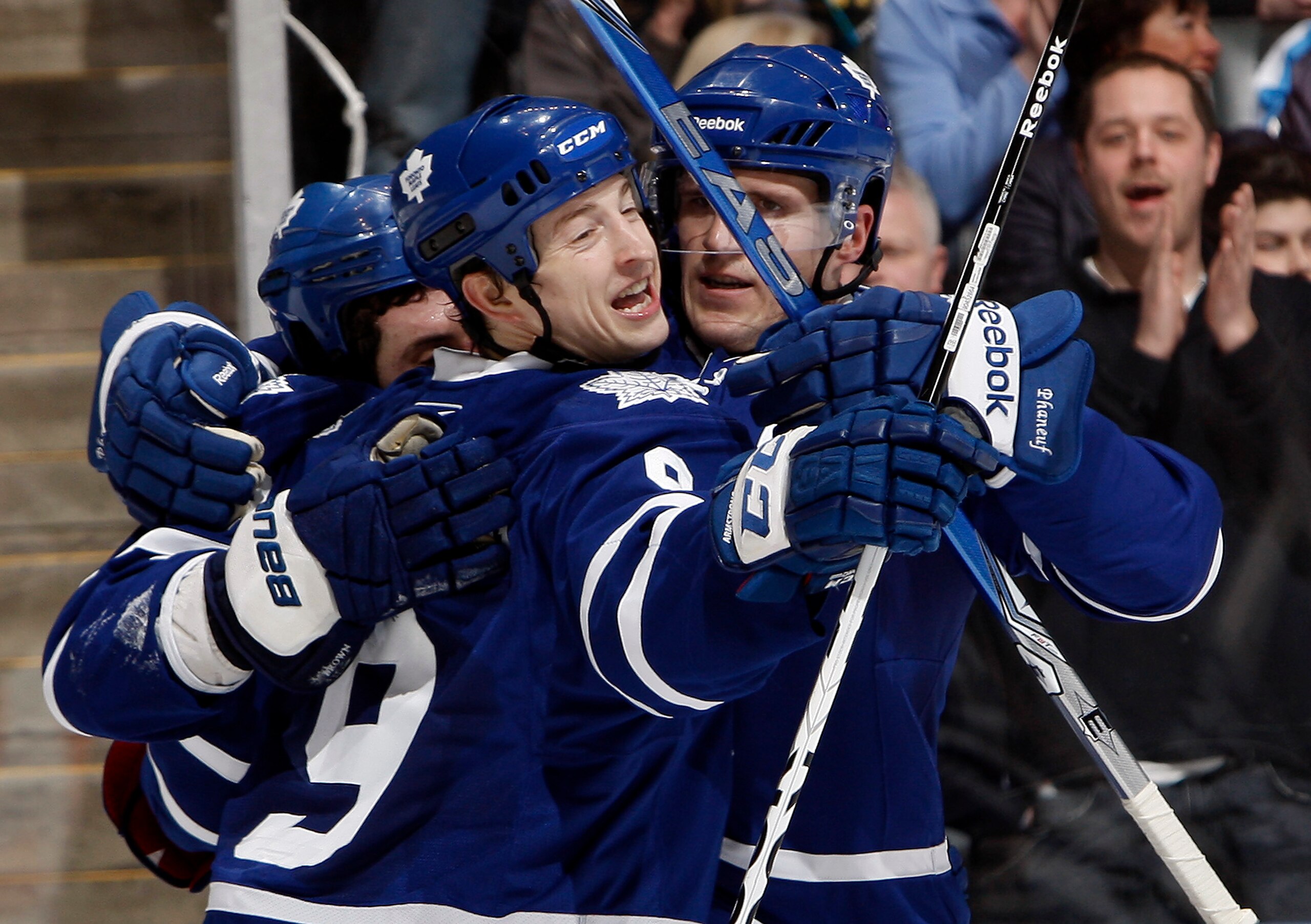 TORONTO, CANADA - FEBRUARY 26: Colby Armstrong #9 and Dion Phaneuf #3  of the Toronto Maple Leafs celebrate Colby Armstrong goal against the Pittsburgh Penguins during game action at the Air Canada Centre February 26, 2011 in Toronto, Ontario, Canada. (Ph