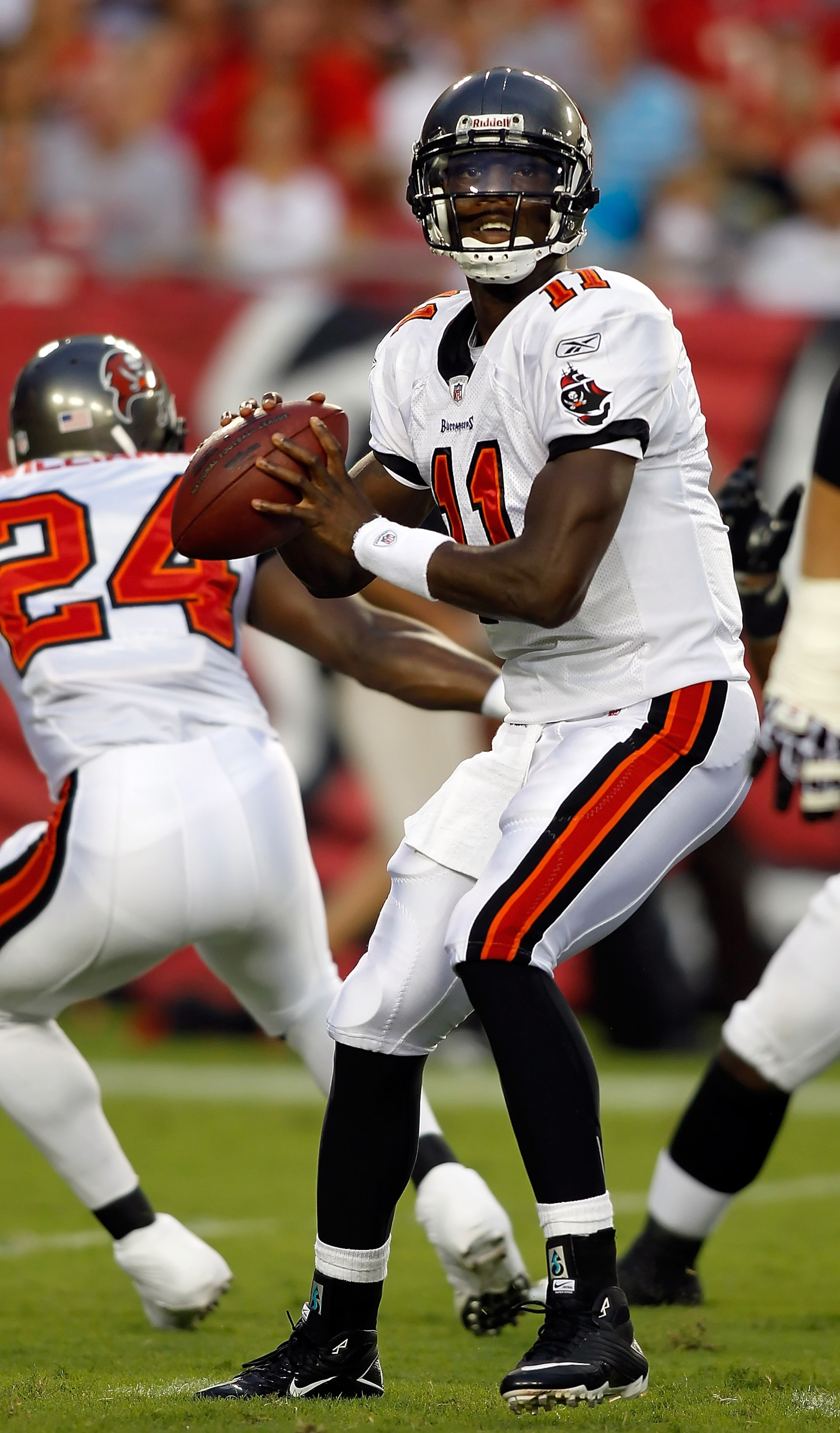 TAMPA, FL - AUGUST 28: Quarterback Josh Johnson #11 of the Tampa Bay Buccaneers looks for an open receiver against the Jacksonville Jaguars during a preseason game at Raymond James Stadium on August 28, 2010 in Tampa, Florida. (Photo by J. Meric/Getty I TAMPA, FL - AUGUST 28: Quarterback Josh Johnson #11 of the Tampa Bay Buccaneers looks for an open receiver against the Jacksonville Jaguars during a preseason game at Raymond James Stadium on August 28, 2010 in Tampa, Florida. (Photo by J. Meric/Getty I