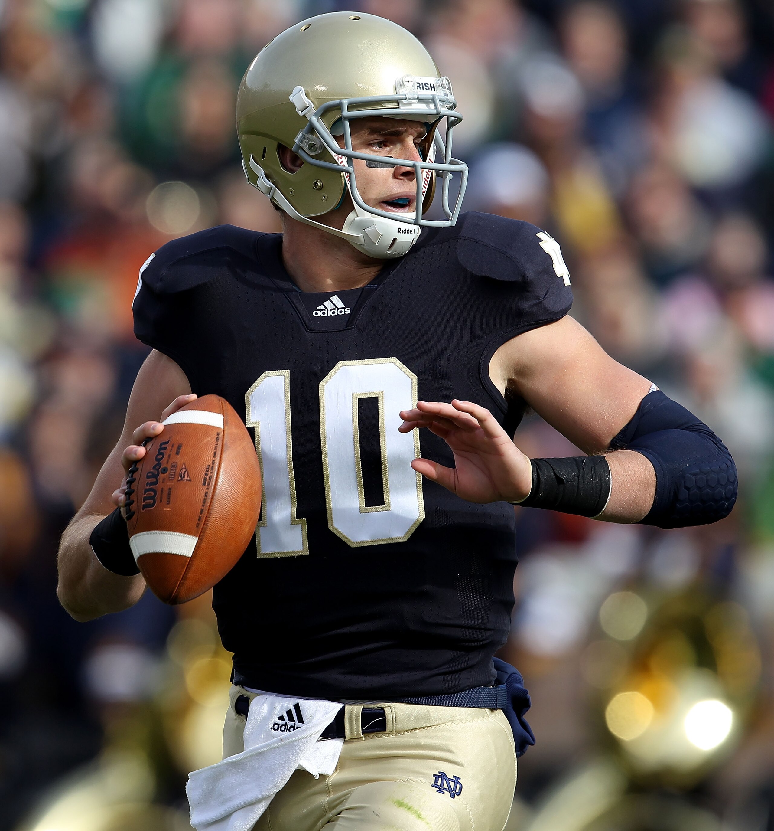 SOUTH BEND, IN - OCTOBER 30: Dayne Crist #10 of the Notre Dame Fighting Irish looks for a receiver against the Tulsa Golden Hurricane at Notre Dame Stadium on October 30, 2010 in South Bend, Indiana. Tulsa defeated Notre Dame 28-27. (Photo by Jonathan Dan