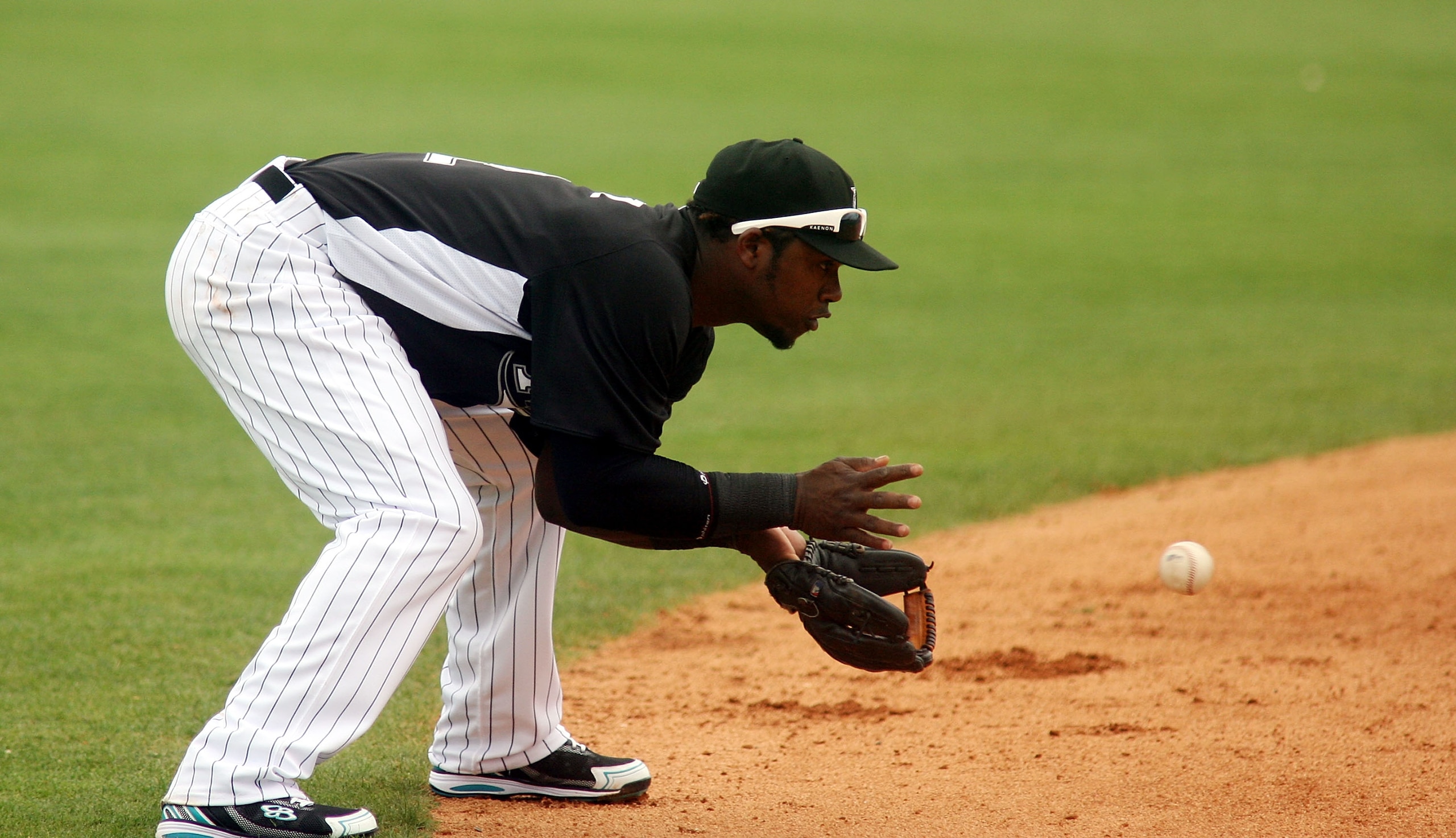 JUPITER, FL - MARCH 06:  Hanley Ramirez #2 of the Florida Marlins plays the field against the St. Louis Cardinals at Roger Dean Stadium on March 6, 2011 in Jupiter, Florida.  (Photo by Marc Serota/Getty Images)