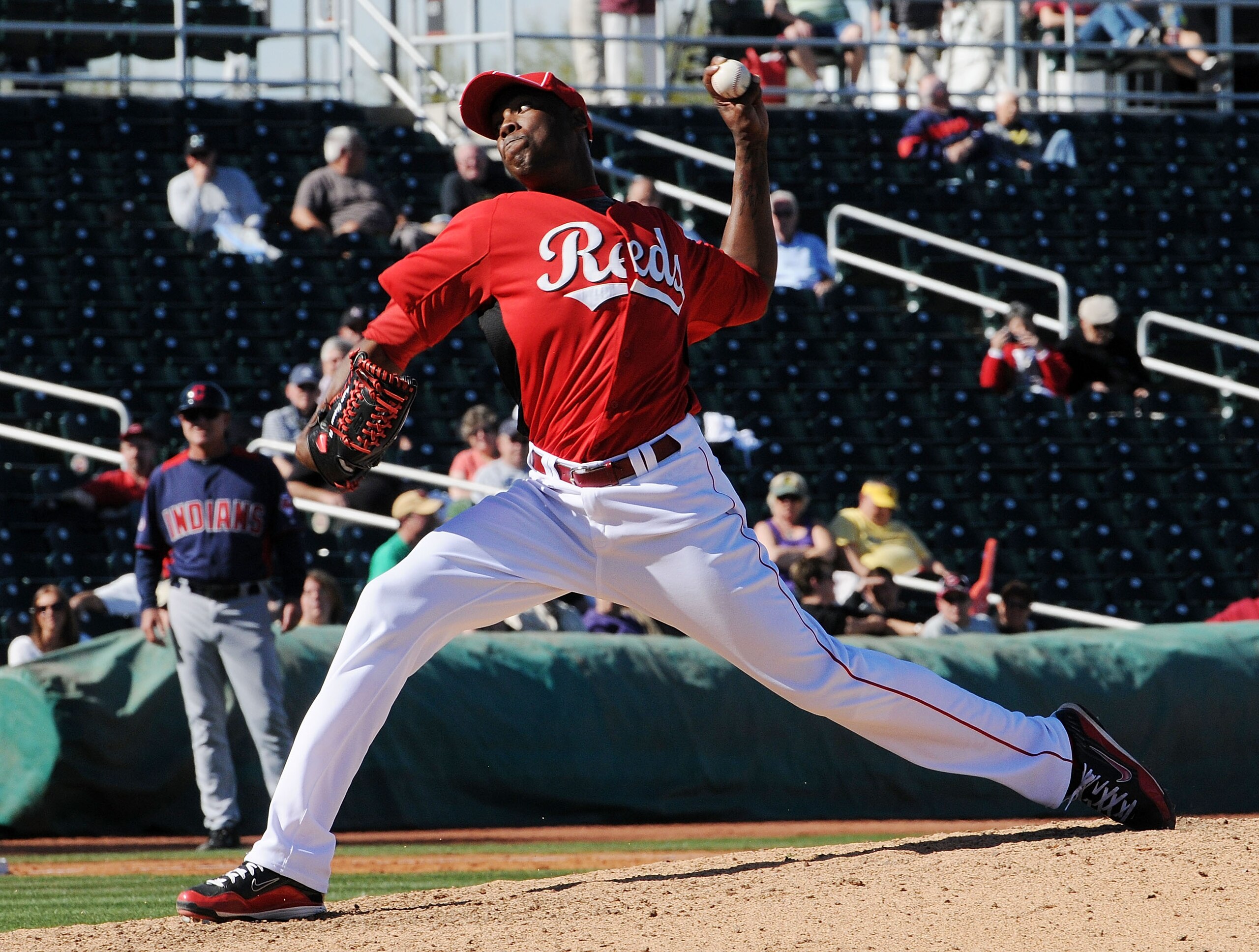 GOODYEAR, AZ - FEBRUARY 28:  Aroldis Chapman #54 of the Cincinnati Reds delivers a pitch against the Cleveland Indians at Goodyear Ballpark on February 28, 2011 in Goodyear, Arizona.  (Photo by Norm Hall/Getty Images)