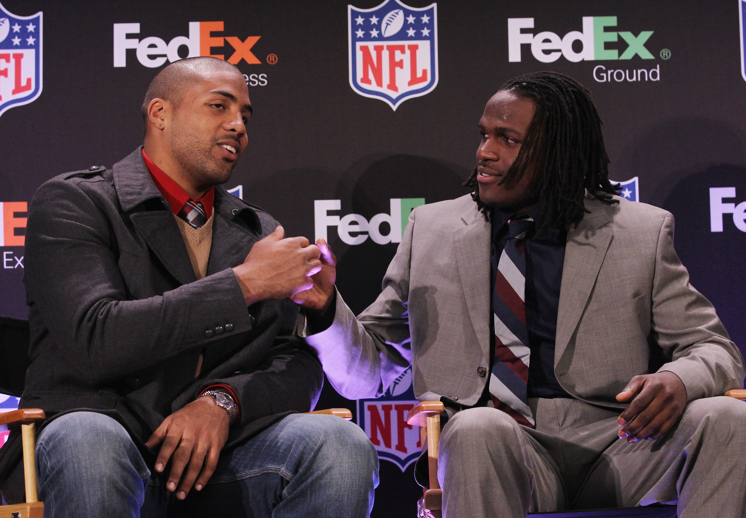 DALLAS, TX - FEBRUARY 02: Jamaal Charles (R) of the Kansas City Chiefs shakes hands with Arian Foster of the Houston Texans at the Super Bowl XLV media center on February 2, 2011 in Dallas, Texas. Charles was named FedEx Ground NFL Player of the Year. (Ph