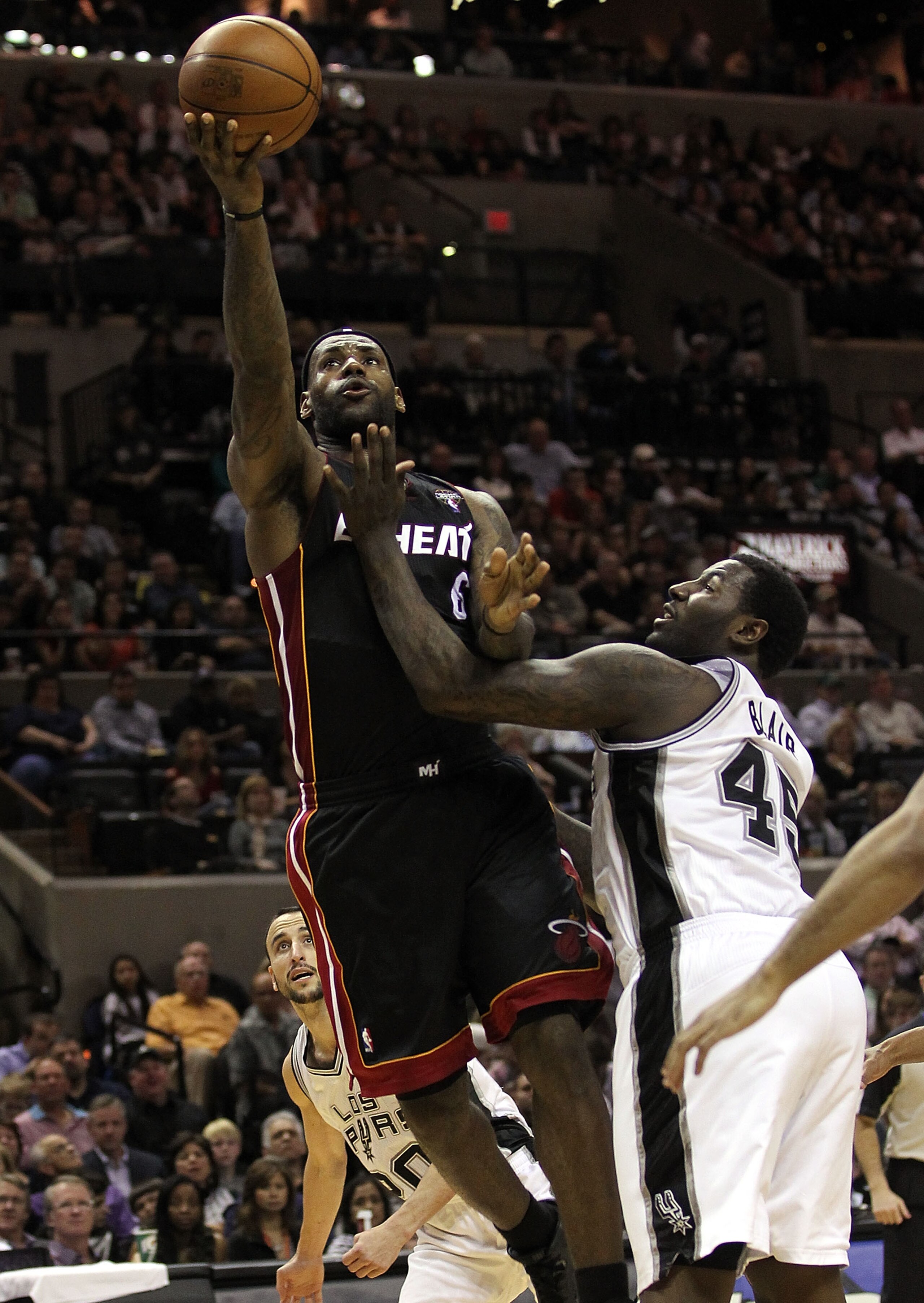 SAN ANTONIO, TX - MARCH 04:  Forward LeBron James #6 of the Miami Heat takes a shot against DeJuan Blair #45 of the San Antonio Spurs at AT&T Center on March 4, 2011 in San Antonio, Texas.   NOTE TO USER: User expressly acknowledges and agrees that, by do