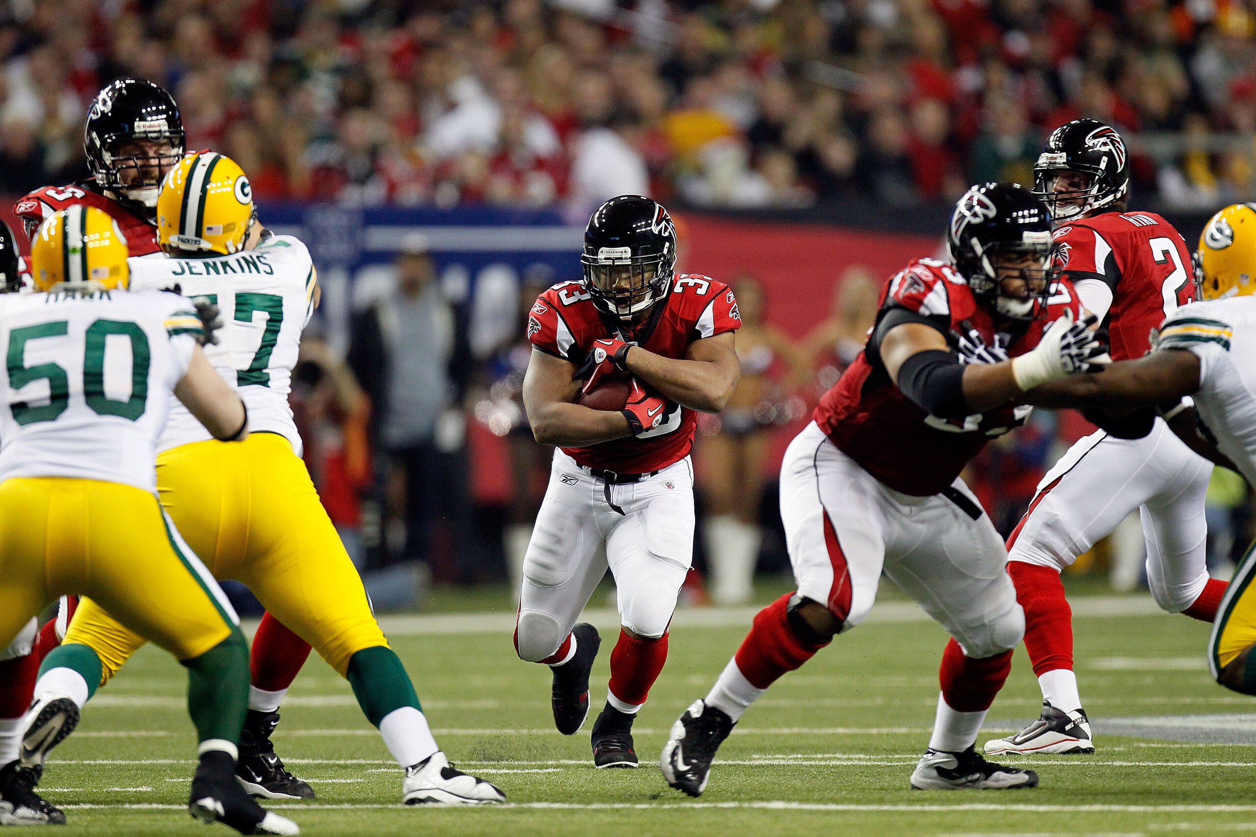 ATLANTA, GA - JANUARY 15:  Running Back Michael Turner #33 of the Atlanta Falcons runs the ball against the Green Bay Packers during their 2011 NFC divisional playoff game at Georgia Dome on January 15, 2011 in Atlanta, Georgia. The Packers won 48-21.  (P