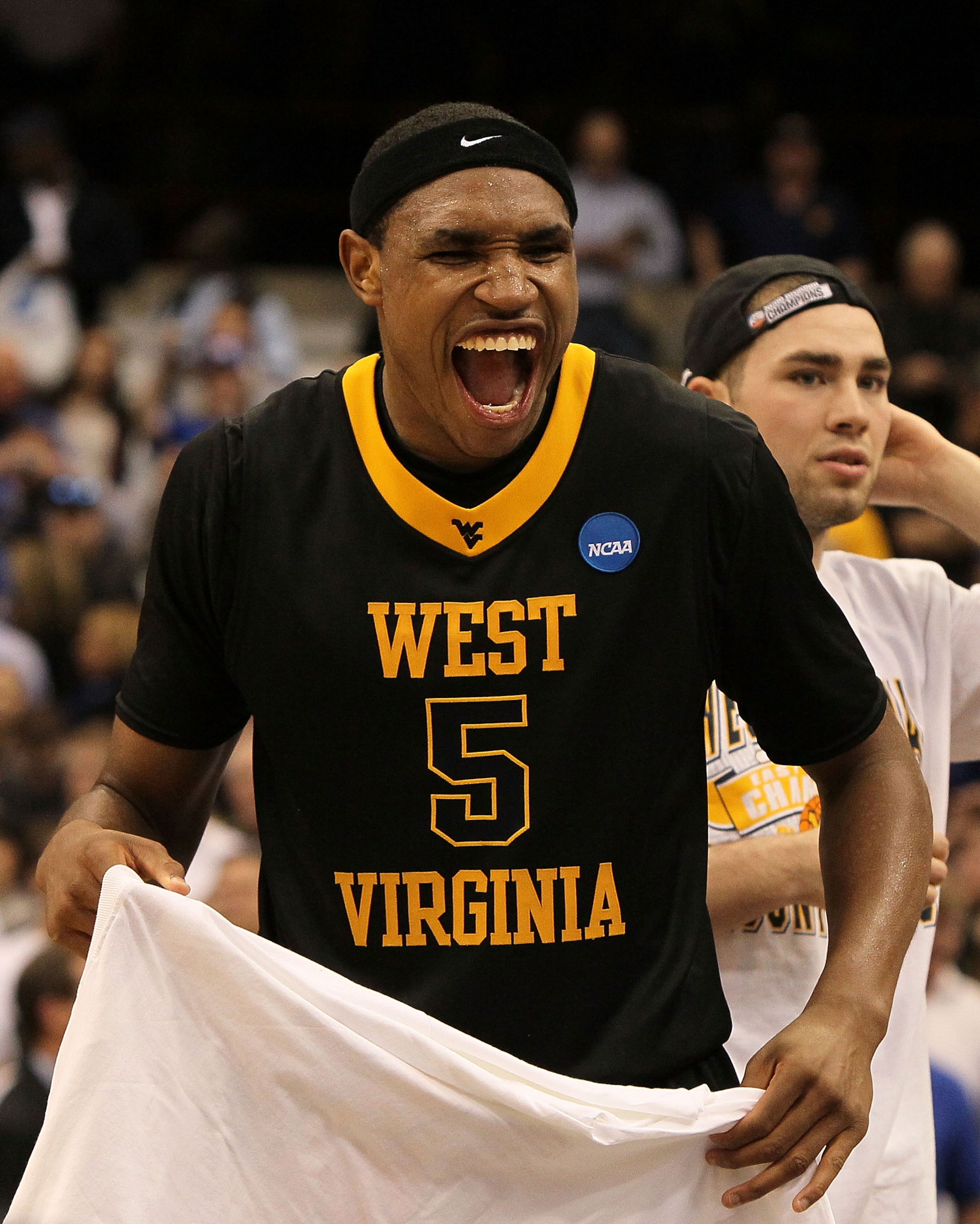 SYRACUSE, NY - MARCH 27:  Kevin Jones #5 of the West Virginia Mountaineers celebrates after West Virginia won 73-66 against the Kentucky Wildcats during the east regional final of the 2010 NCAA men's basketball tournament at the Carrier Dome on March 27,