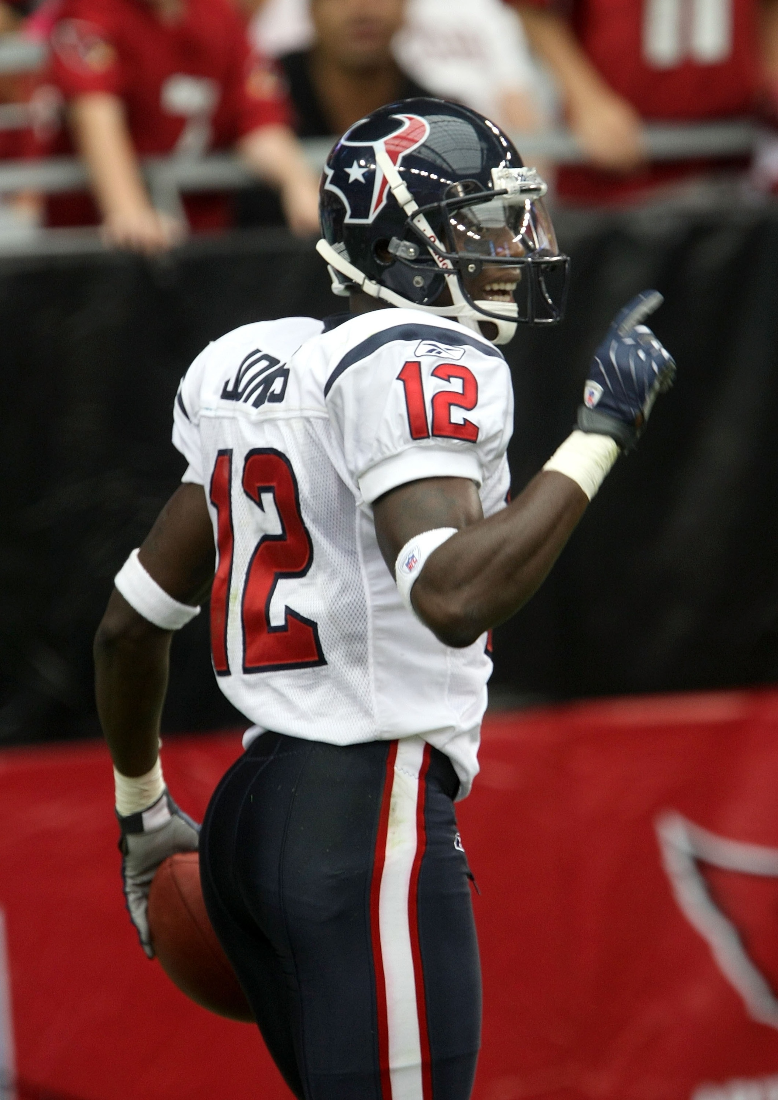 GLENDALE, AZ - AUGUST 18:  Wide receiver Jacoby Jones #12 of the Houston Texans celebrates after his 80-yard punt return for a touchdown against the Arizona Cardinals during their NFL preseason game at University of Phoenix Stadium August 18, 2007 in Glen