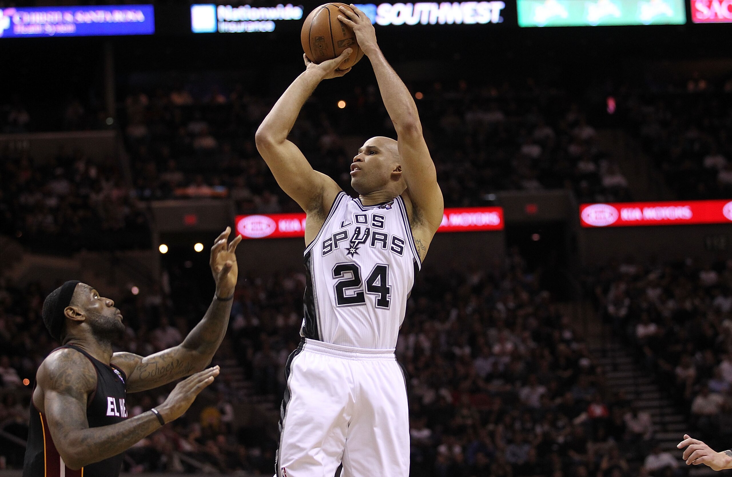 SAN ANTONIO, TX - MARCH 04:  Guard Richard Jefferson #24 of the San Antonio Spurs takes a shot against LeBron James #6 of the Miami Heat at AT&T Center on March 4, 2011 in San Antonio, Texas.   NOTE TO USER: User expressly acknowledges and agrees that, by