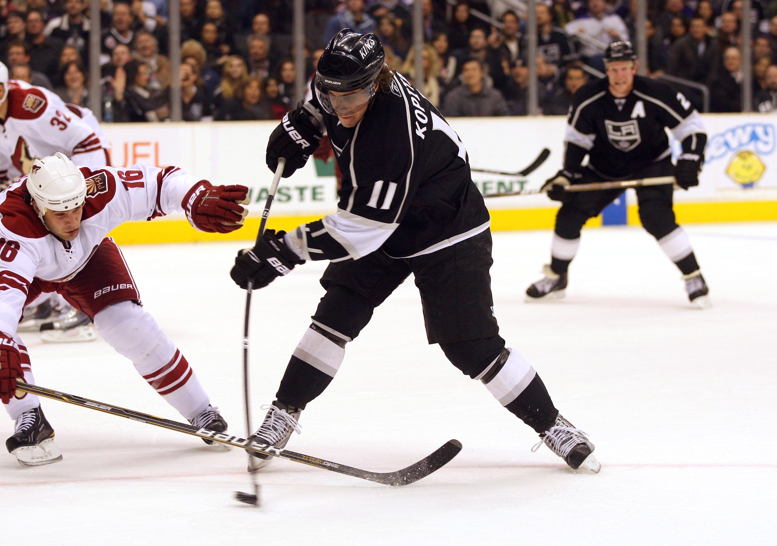 LOS ANGELES, CA - MARCH 03:  Anze Kopitar #11 of the Los Angeles Kings shoots the puck on net against Rostislav Klesla #16 of the Phoenix Coyotes in the second period during the NHL game at Staples Center on March 3, 2011 in Los Angeles, California.  (Pho