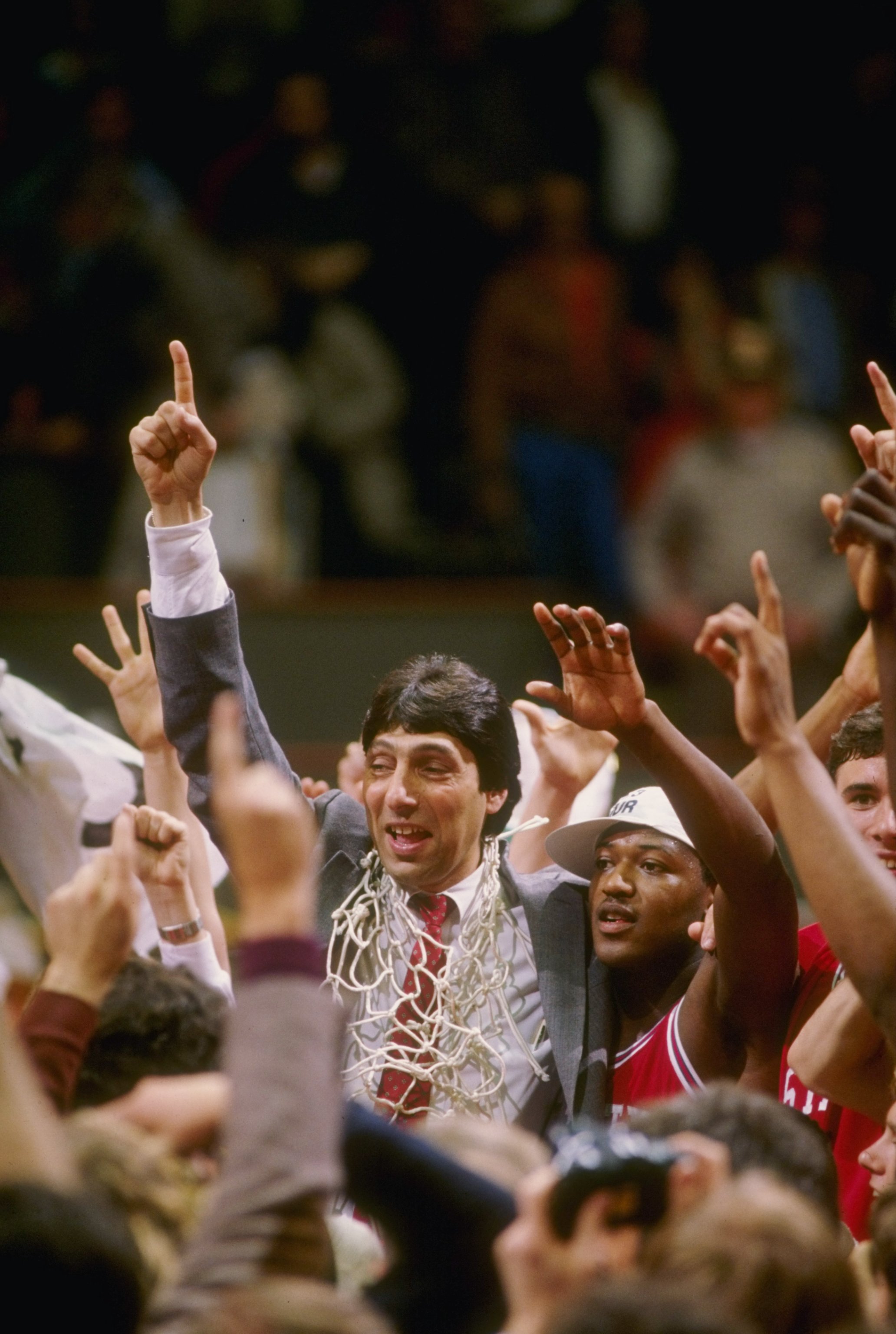4 Apr 1983: Head coach Jim Valvano of the North Carolina State Wolfpack celebrates with his team after the Wolfpack defeated the Houston Cougars 54-52 in the NCAA men''s basketball championship game at University Arena in Albuquerque, New Mexico.