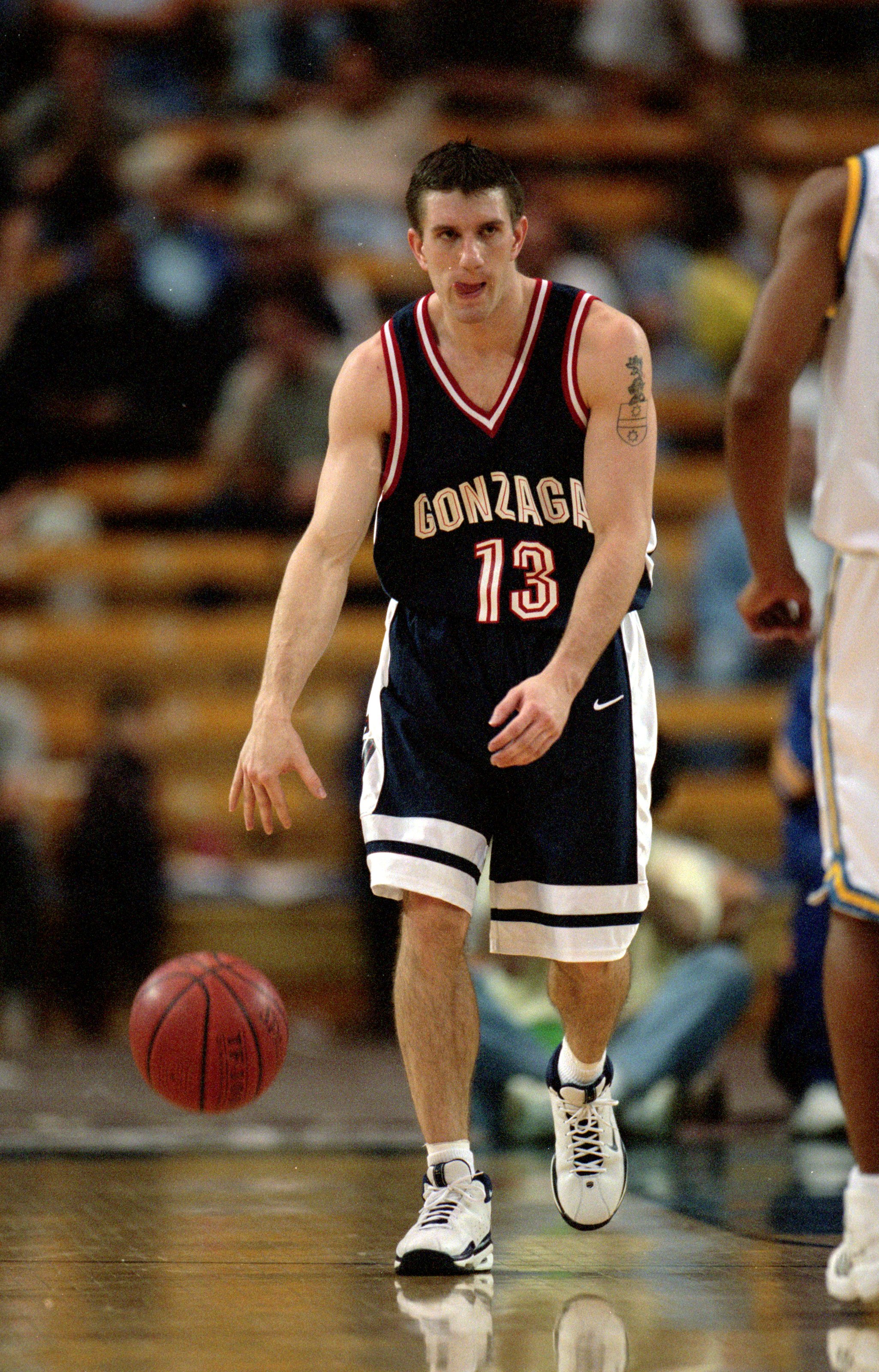 11 Dec 1999: Matt Santangelo #13 of the Gonzaga Bulldogs dribbles the ball down court during the game against the UCLA Bruins at the Pauley Pavillion in Westwood, California. The Bulldogs defeated the Bruins 59-43. Mandatory Credit: Jeff Gross /Allsport