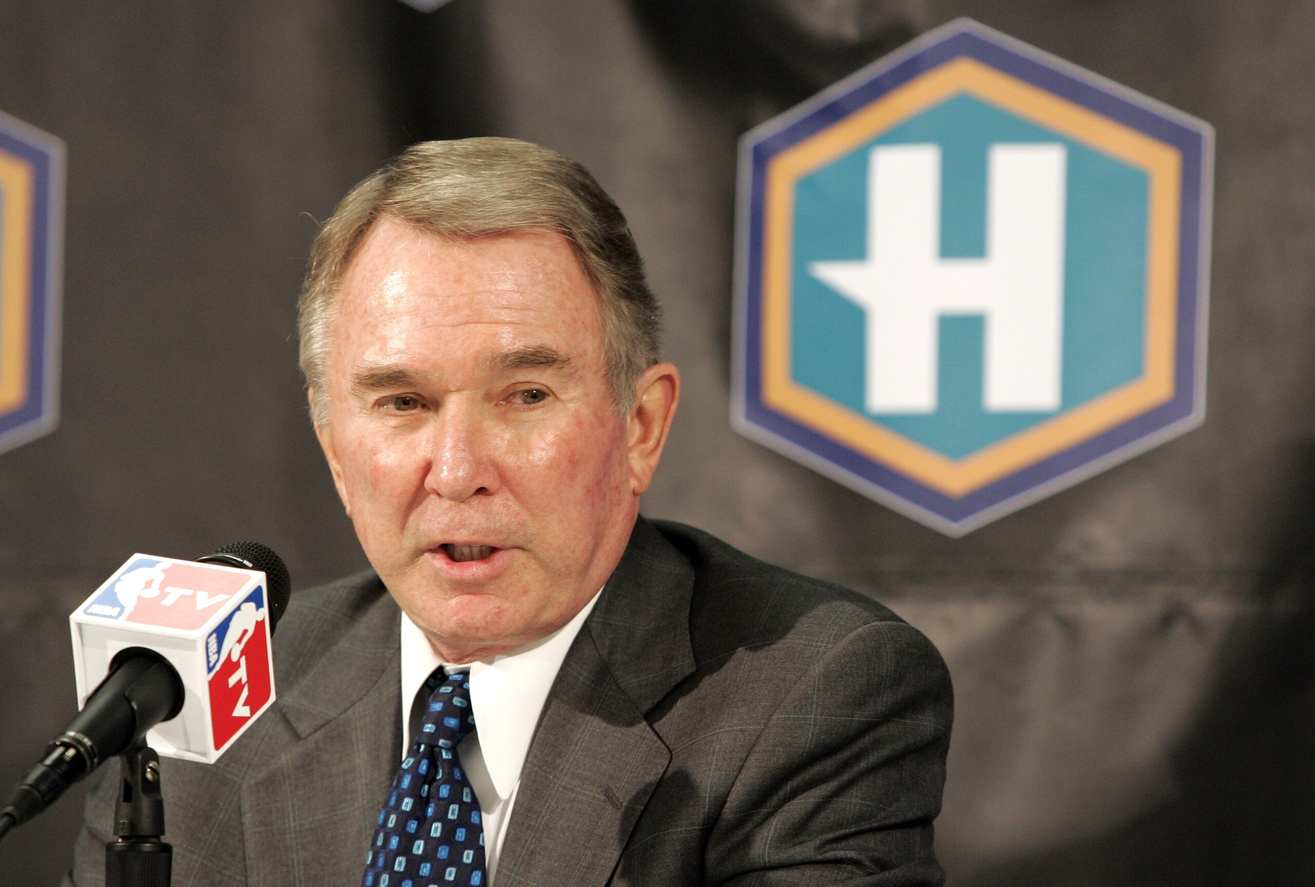 NEW ORLEANS - MARCH 8:  Owner George Shinn of the New Orleans/Oklahoma City Hornets talks to the media before the first game to be played since Hurricane Katrina as they take on the Los Angeles Lakers on March 8, 2006 at the New Orleans Arena in New Orlea