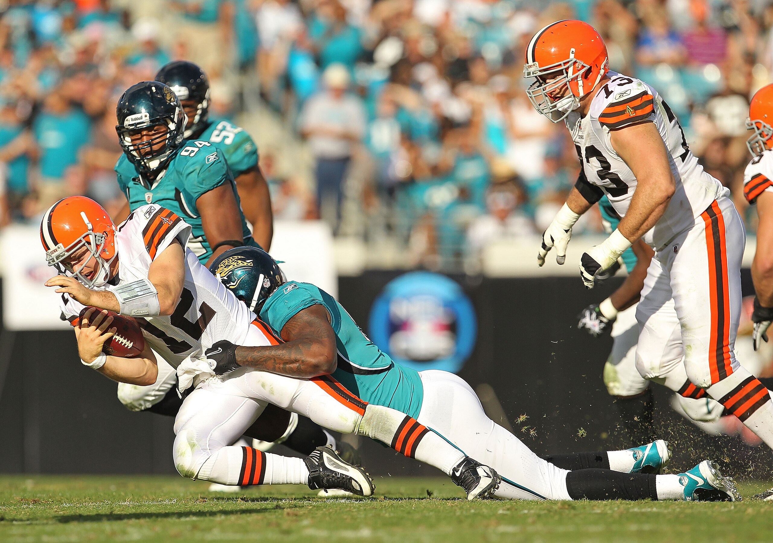 JACKSONVILLE, FL - NOVEMBER 21:  Colt McCoy #12  of the Cleveland Browns is sacked by Larry Hart #59  during a game agaisnt the Jacksonville Jaguars at EverBank Field on November 21, 2010 in Jacksonville, Florida.  (Photo by Mike Ehrmann/Getty Images)