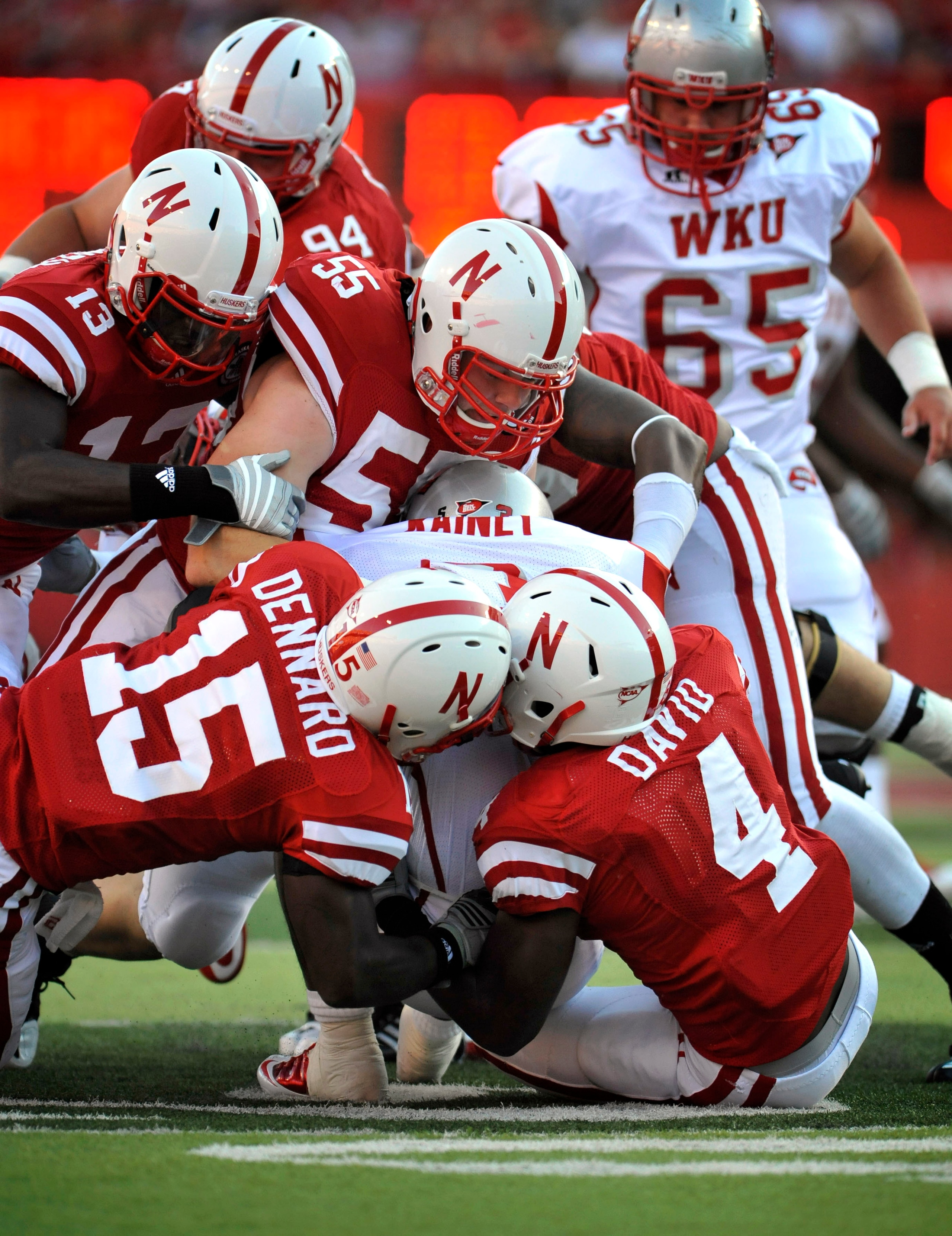 LINCOLN, NE - SEPTEMBER 04:  The Nebraska Cornhuskers defense swarms Bobby Rainey #3 of the Western Kentucky Hilltoppers during the first half of their game at Memorial Stadium on September 4, 2010 in Lincoln, Nebraska.  (Photo by Eric Francis/Getty Image