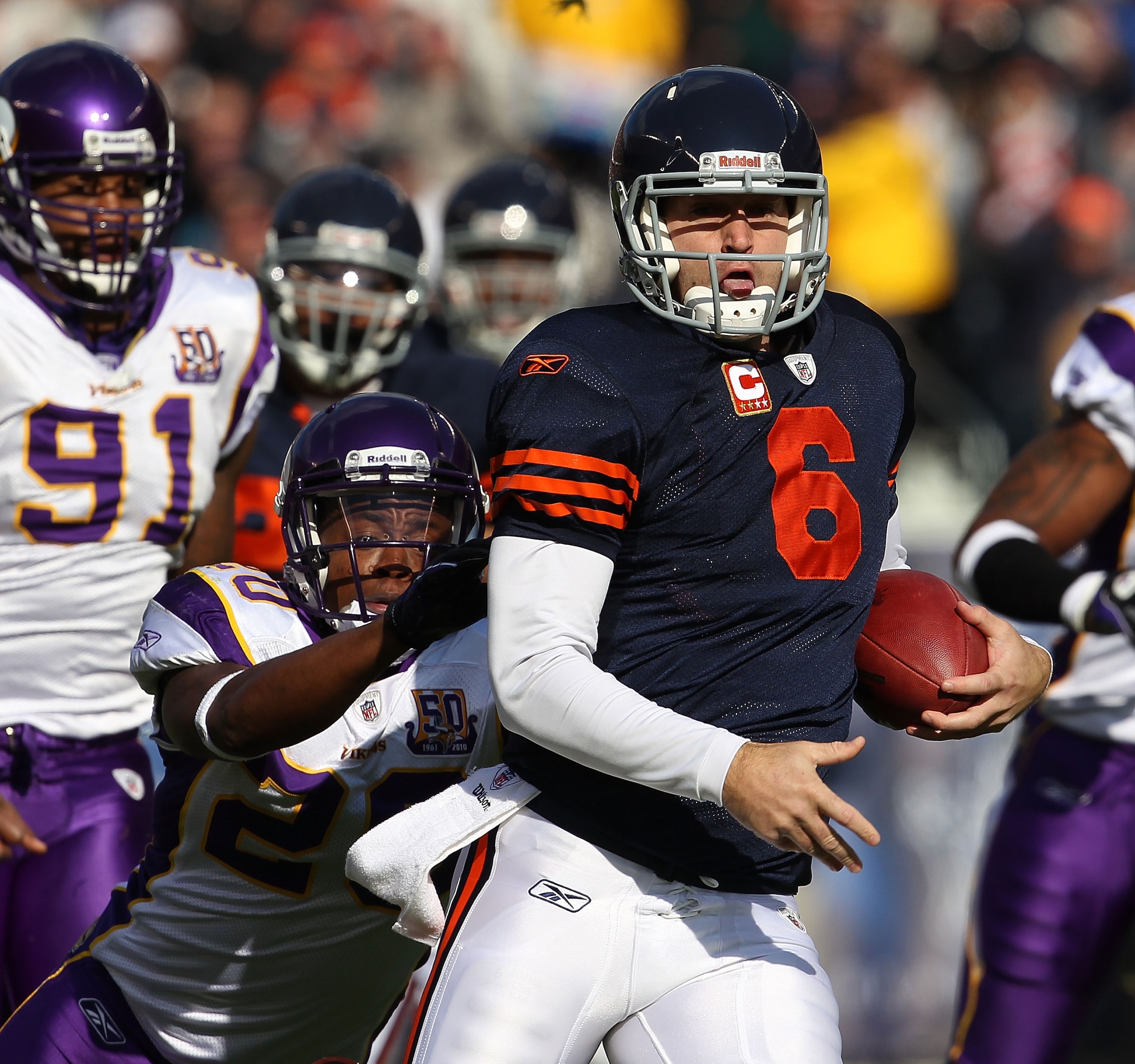 CHICAGO - NOVEMBER 14: Jay Cutler #6 of the Chicago Bears runs for a first down as Ray Edwards #91 and Madieu Williams #20 of the Minnesota Vikings give chase at Soldier Field on November 14, 2010 in Chicago, Illinois. The Bears defeated the Vikings 27-13