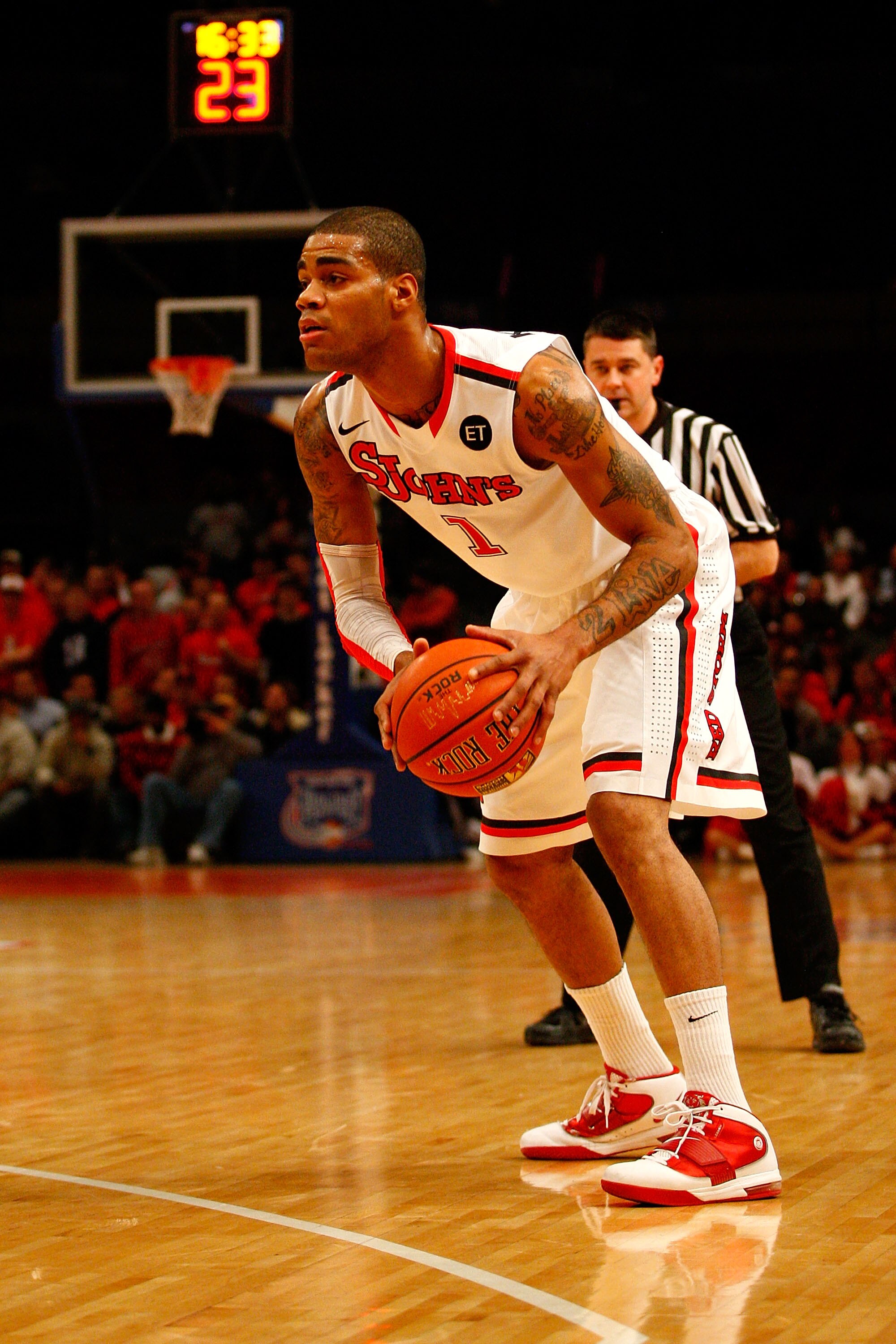 NEW YORK, NY - DECEMBER 20:  D.J. Kennedy #1 of the St. John's Red Storm looks to pass the ball against the Davidson Wildcats during the Madison Square Garden Holiday Festival at Madison Square Garden on December 20, 2010 in New York City.  (Photo by Chri