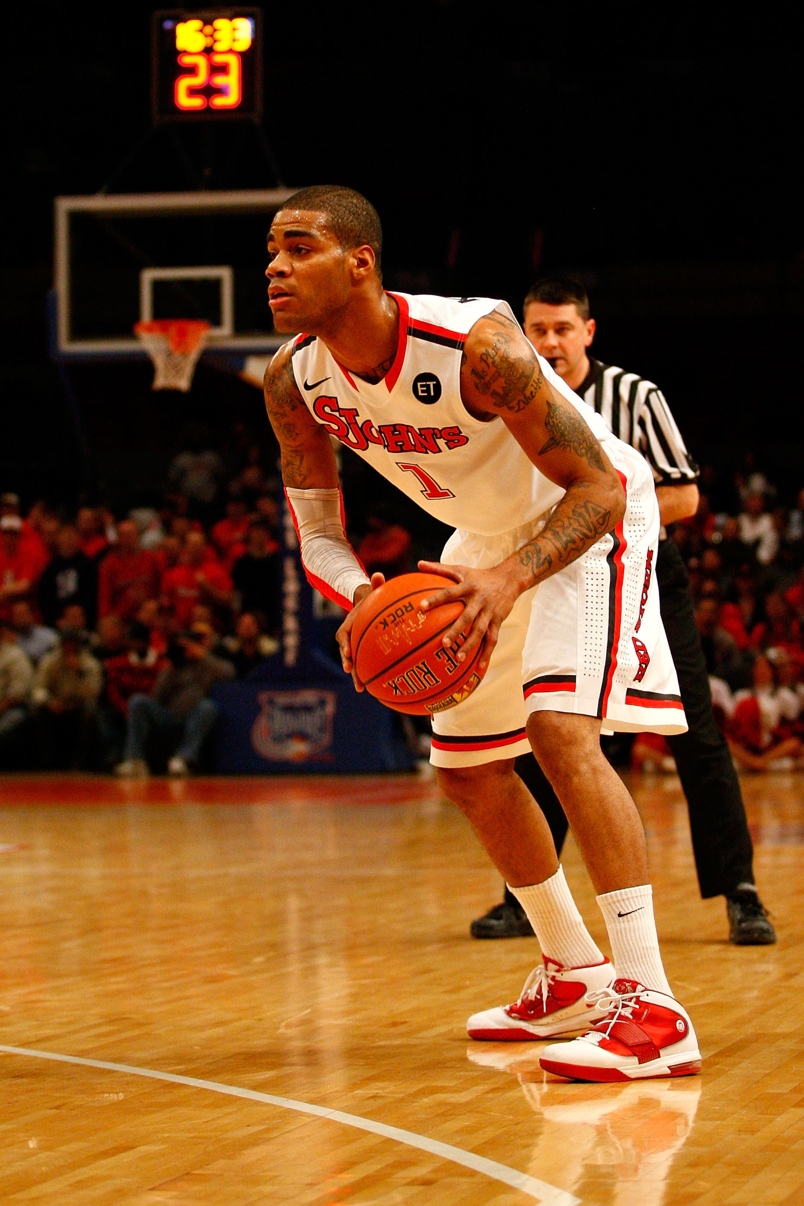 NEW YORK, NY - DECEMBER 20:  D.J. Kennedy #1 of the St. John's Red Storm looks to pass the ball against the Davidson Wildcats during the Madison Square Garden Holiday Festival at Madison Square Garden on December 20, 2010 in New York City.  (Photo by Chri