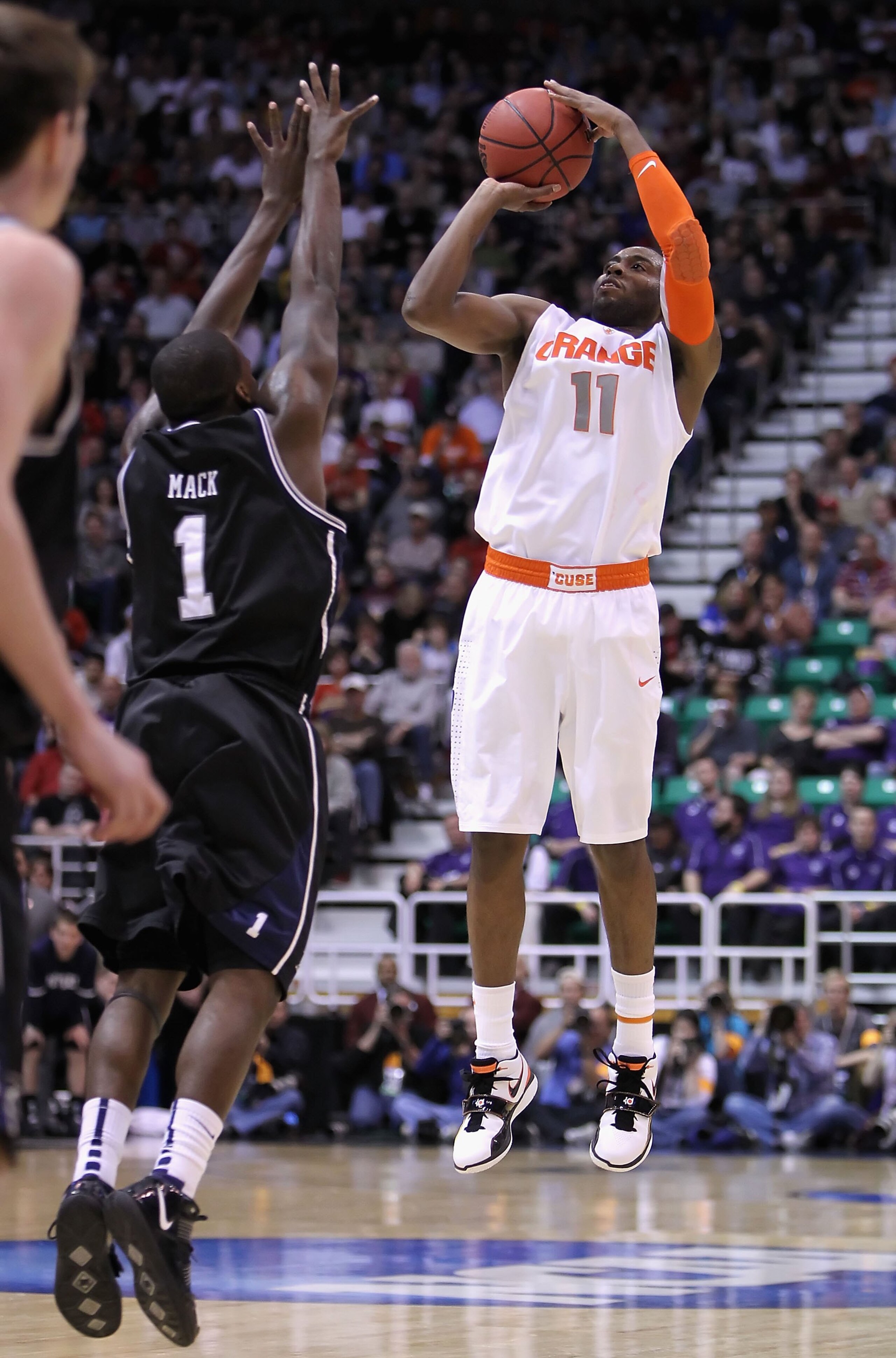 SALT LAKE CITY - MARCH 25:  Scoop Jardine #11 of the Syracuse Orange puts up a shot against the Butler Bulldogs during the west regional semifinal of the 2010 NCAA men's basketball tournament at the Energy Solutions Arena on March 25, 2010 in Salt Lake Ci