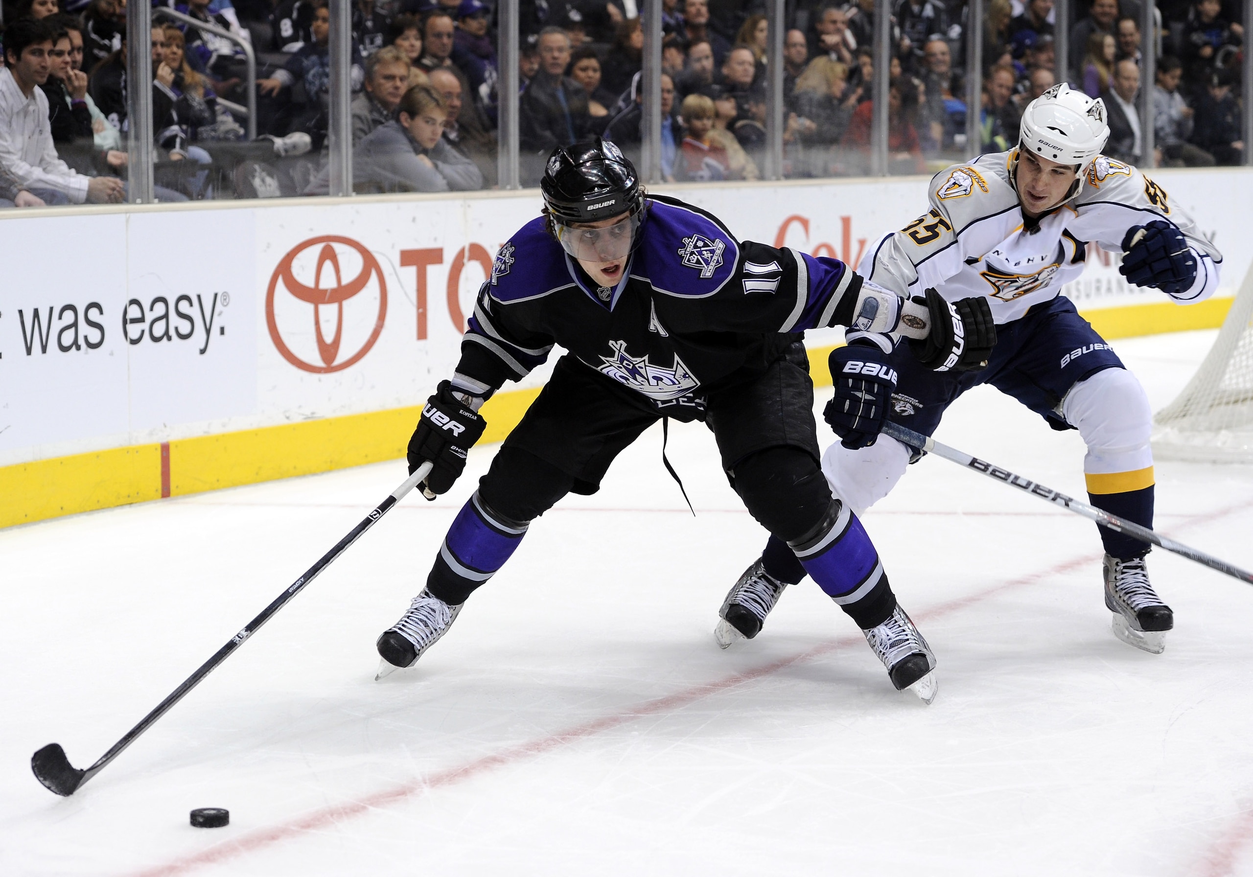 LOS ANGELES, CA - JANUARY 06: Anze kopitar #11 of the Los Angeles Kings fends off Shane O'Brien #55 of the Nashville Predators at the Staples Center on January 6, 2011 in Los Angeles, California. (Photo by Harry How/Getty Images) LOS ANGELES, CA - JANUARY 06: Anze kopitar #11 of the Los Angeles Kings fends off Shane O'Brien #55 of the Nashville Predators at the Staples Center on January 6, 2011 in Los Angeles, California. (Photo by Harry How/Getty Images)