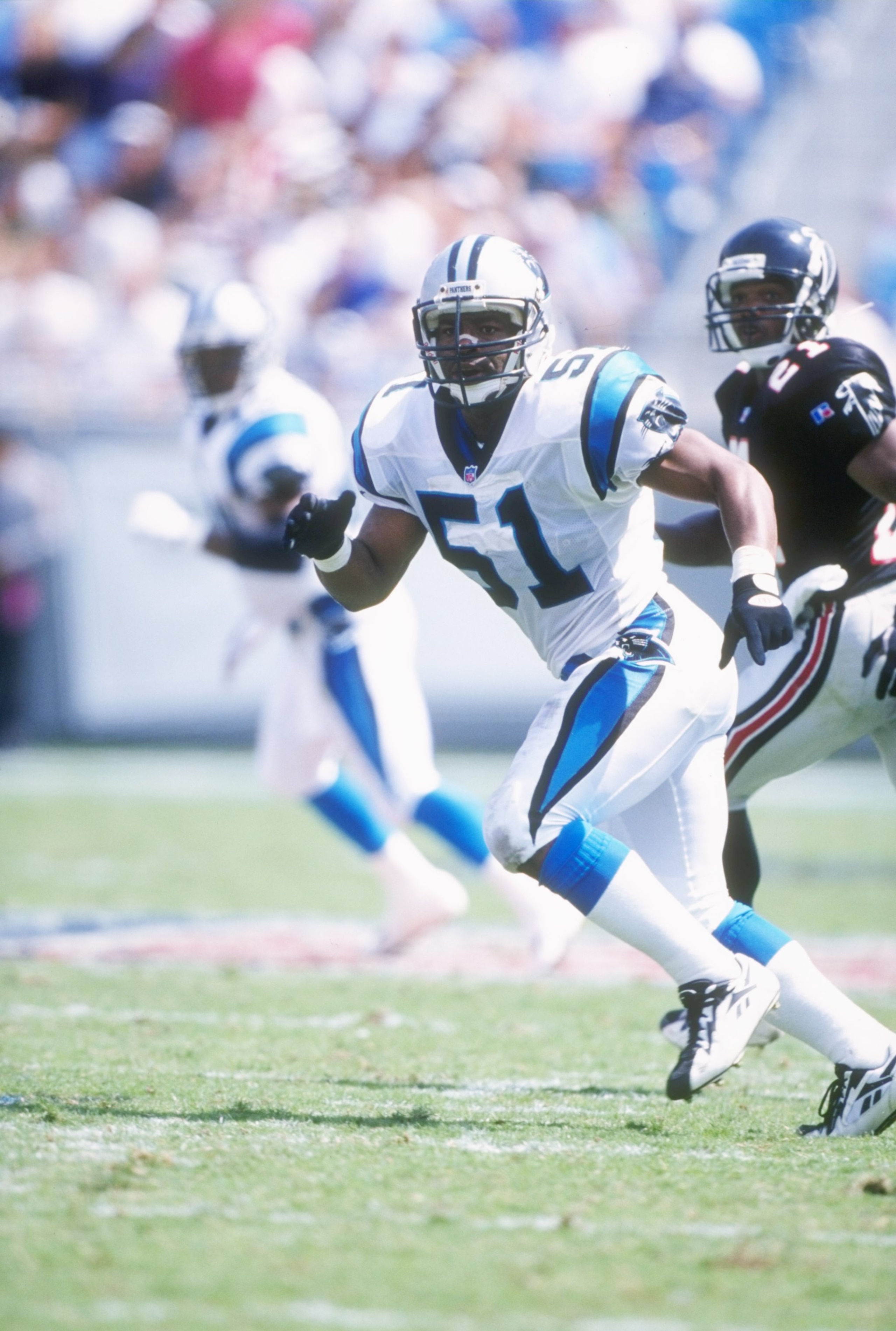 Linebacker Sam Mills of the Carolina Panthers drops into pass coverage during the Panthers 29-6 victory over the Atlanta Falcons at Ericsson Stadium in Charlotte, North Carolina. The game was the inaugural game in the Panthers Ericsson Stadium.
