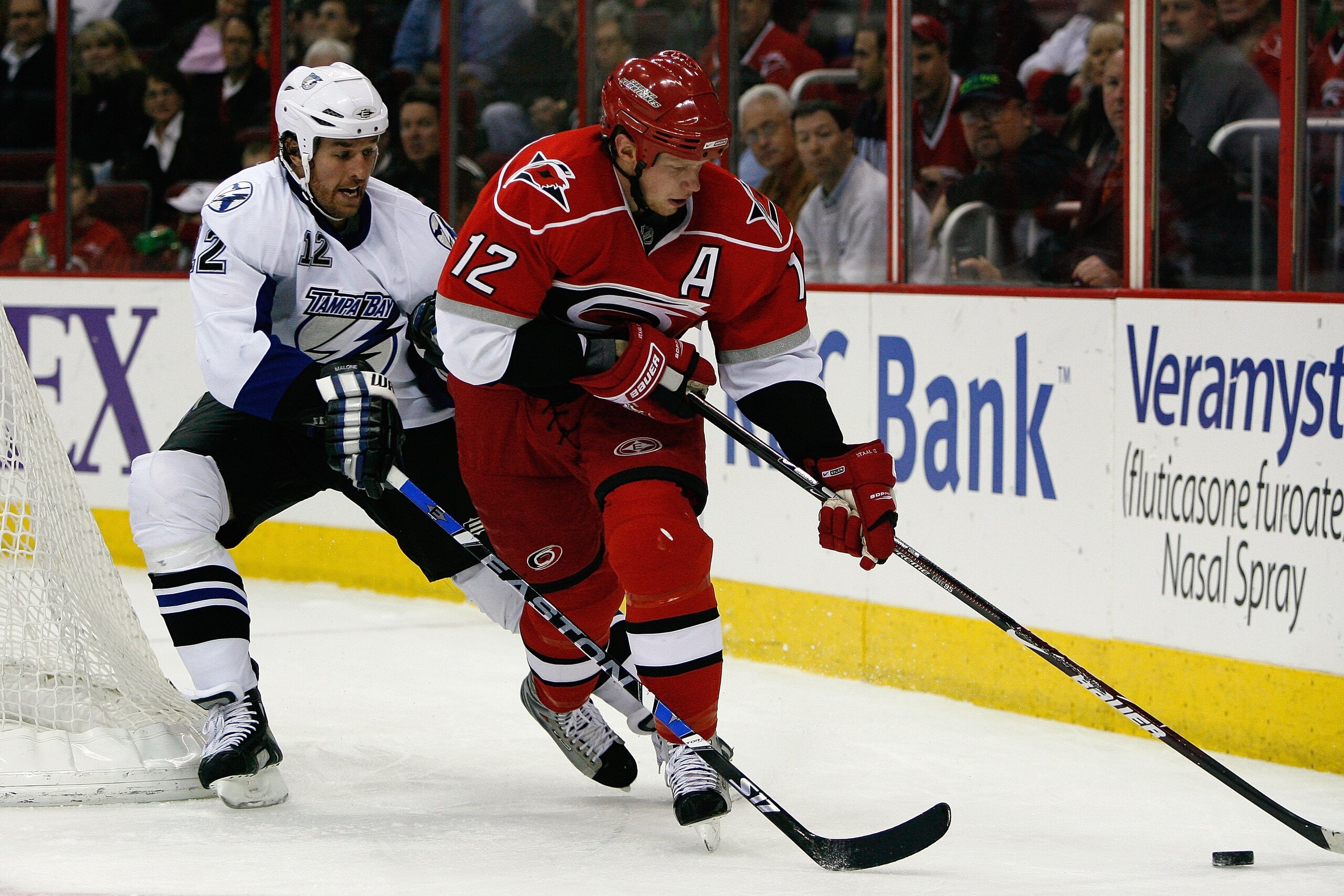 RALEIGH, NC - FEBRUARY 20: Eric Staal #12 of the Carolina Hurricanes skates with the puck against Ryan Malone #12 of the Tampa Bay Lightning during the game on February 20, 2009 at RBC Center in Raleigh, North Carolina. (Photo by Kevin C. Cox/Getty Imag RALEIGH, NC - FEBRUARY 20: Eric Staal #12 of the Carolina Hurricanes skates with the puck against Ryan Malone #12 of the Tampa Bay Lightning during the game on February 20, 2009 at RBC Center in Raleigh, North Carolina. (Photo by Kevin C. Cox/Getty Imag