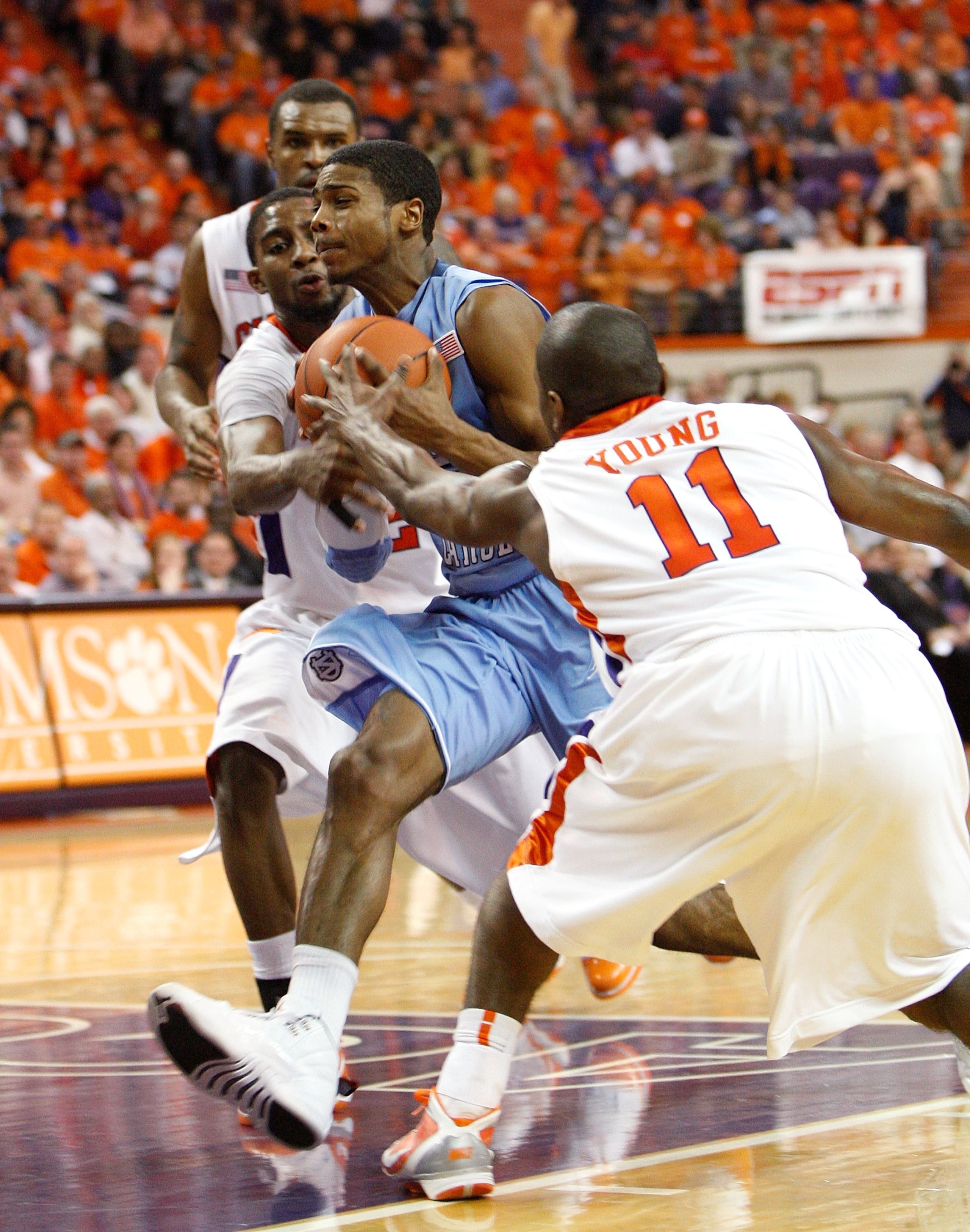 CLEMSON, SC - JANUARY 13:  Andre Young #11 and Demontez Stitt #2 of the Clemson Tigers against Dexter Strickland #5 of the North Carolina Tar Heels at Littlejohn Coliseum on January 13, 2010 in Clemson, South Carolina.  (Photo by Kevin C. Cox/Getty Images