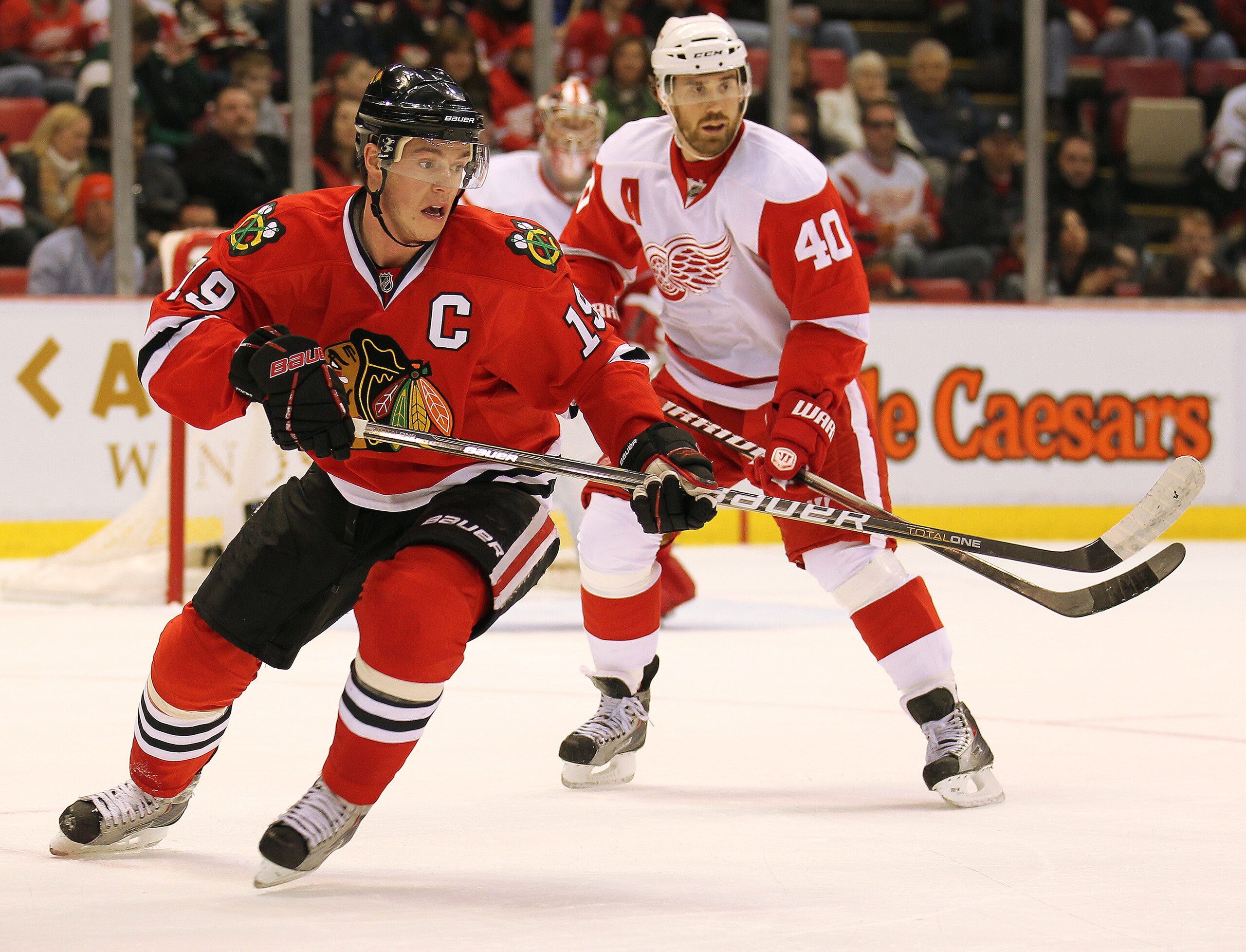 DETROIT, MI - JANUARY 22: Jonathan Toews #19 of the Chicago Black Hawks skates after a loose puck in a game against the Detroit Red Wings on January 22, 2011 at the Joe Louis Arena in Detroit, Michigan. The Hawks defeated the Wings 4-1. (Photo by Claus A DETROIT, MI - JANUARY 22: Jonathan Toews #19 of the Chicago Black Hawks skates after a loose puck in a game against the Detroit Red Wings on January 22, 2011 at the Joe Louis Arena in Detroit, Michigan. The Hawks defeated the Wings 4-1. (Photo by Claus A