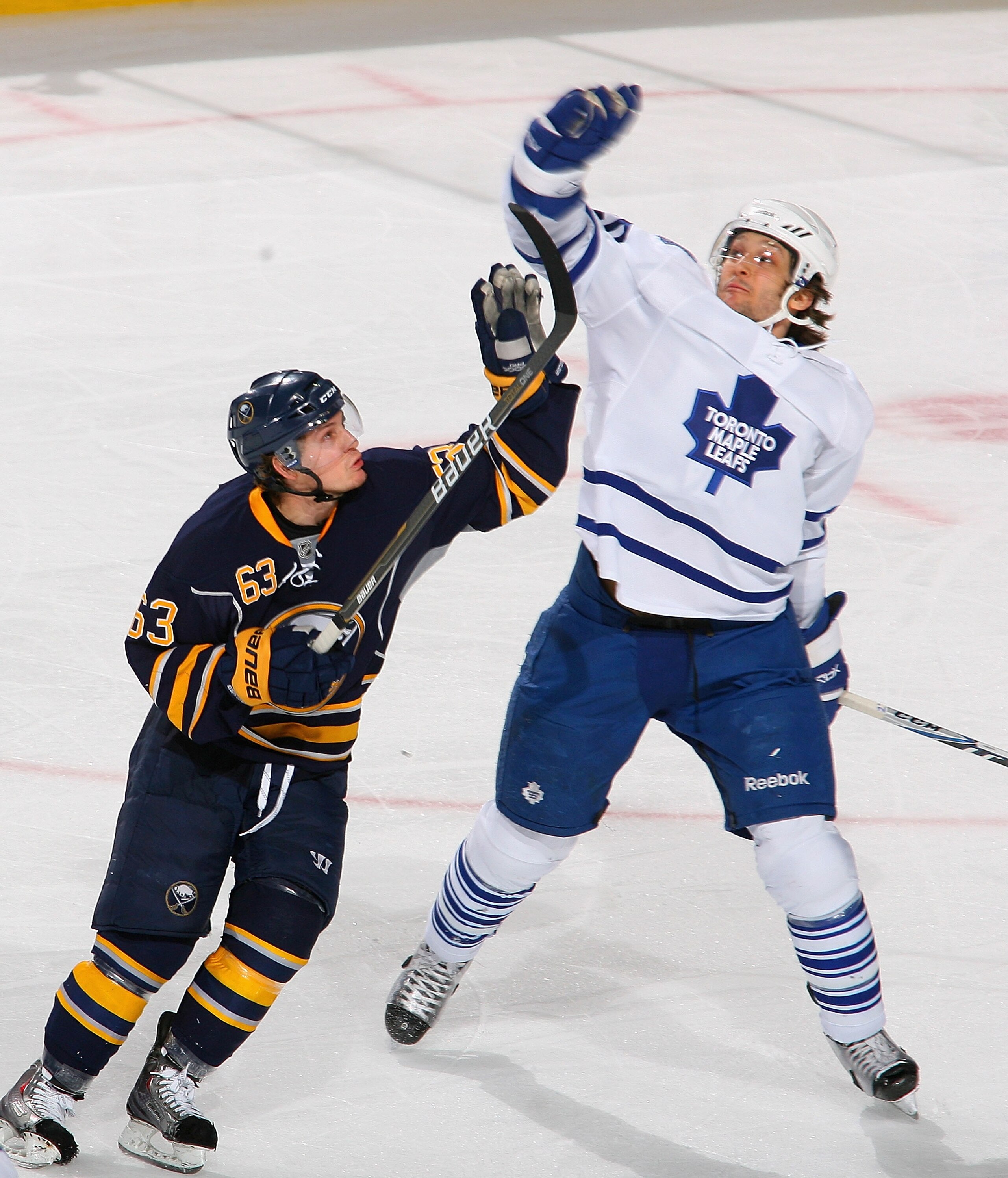 BUFFALO, NY - FEBRUARY 16: Tyler Ennis #63 of the Buffalo Sabres and Christian Hanson #20 of the Toronto Maple Leafs try to knock the puck out of the air at HSBC Arena on February 16, 2011 in Buffalo, New York. Toronto won 2-1. (Photo by Rick Stewart/Gett BUFFALO, NY - FEBRUARY 16: Tyler Ennis #63 of the Buffalo Sabres and Christian Hanson #20 of the Toronto Maple Leafs try to knock the puck out of the air at HSBC Arena on February 16, 2011 in Buffalo, New York. Toronto won 2-1. (Photo by Rick Stewart/Gett