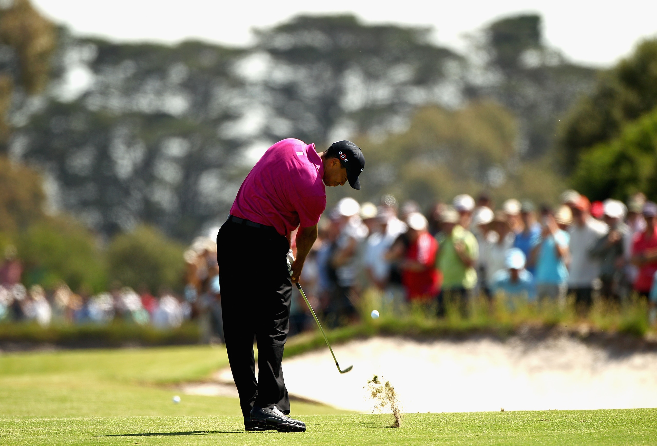 MELBOURNE, AUSTRALIA - NOVEMBER 11:  Tiger Woods of the USA plays an iron shot during day one of the Australian Masters at The Victoria Golf Club on November 11, 2010 in Melbourne, Australia.  (Photo by Ryan Pierse/Getty Images)