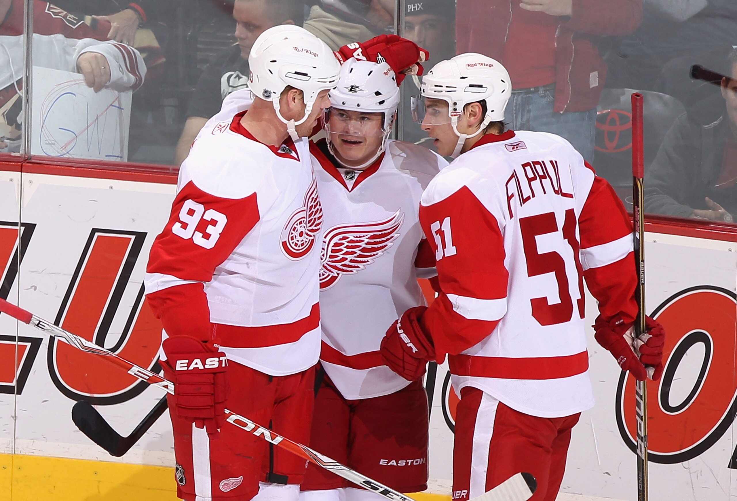 GLENDALE, AZ - MARCH 05:  Johan Franzen #93, Jiri Hudler #26 and Valtteri Filppula #51 of the Detroit Red Wings celebrate after Filppula scored a second period goal against the Phoenix Coyotes during the NHL game at Jobing.com Arena on March 5, 2011 in Gl