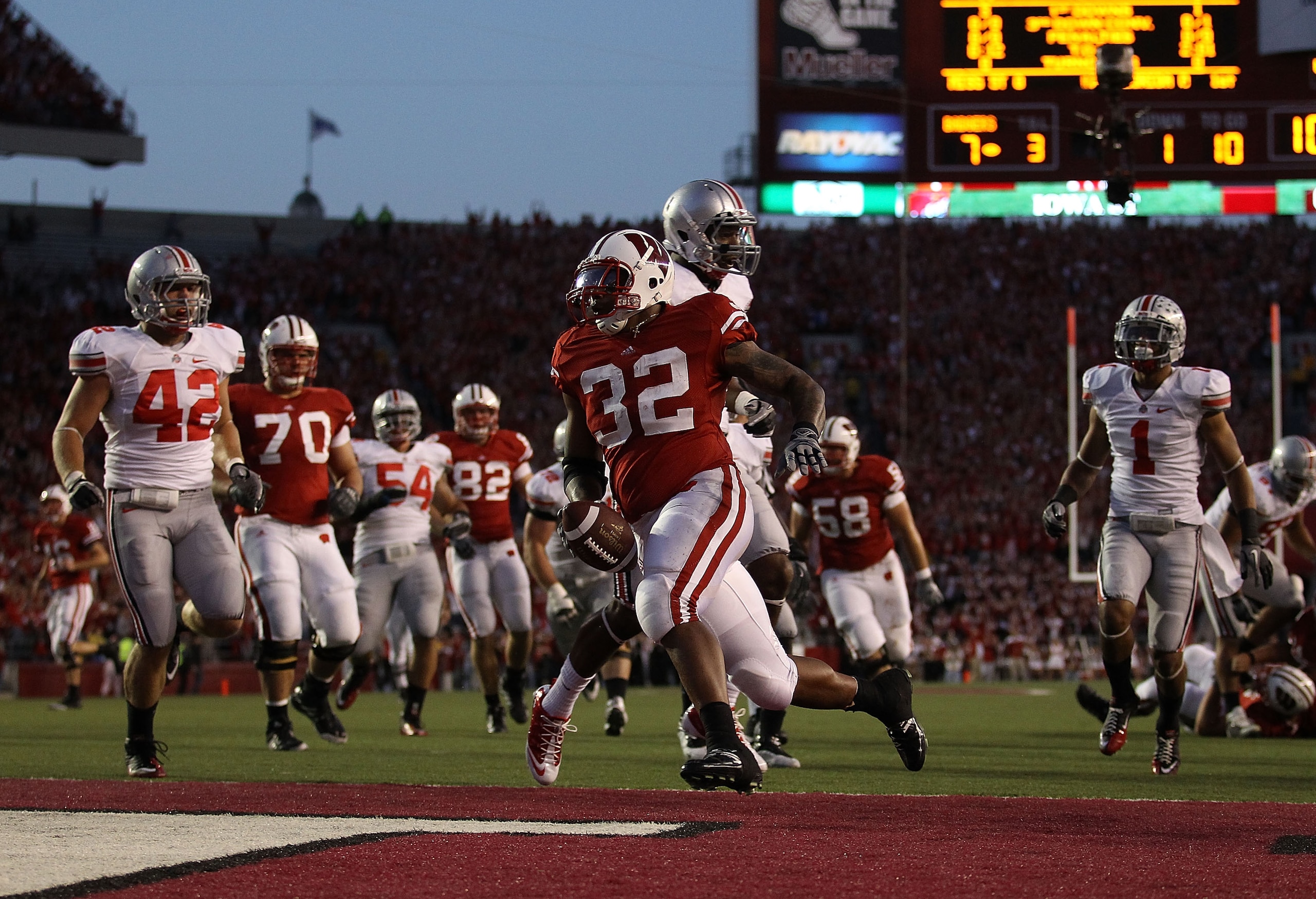 MADISON, WI - OCTOBER 16: John Clay #32 of the Wisconsin Badgers scores a touchdown against the Ohio State Buckeyes at Camp Randall Stadium on October 16, 2010 in Madison, Wisconsin. Wisconsin defeated Ohio State 31-18. (Photo by Jonathan Daniel/Getty Ima