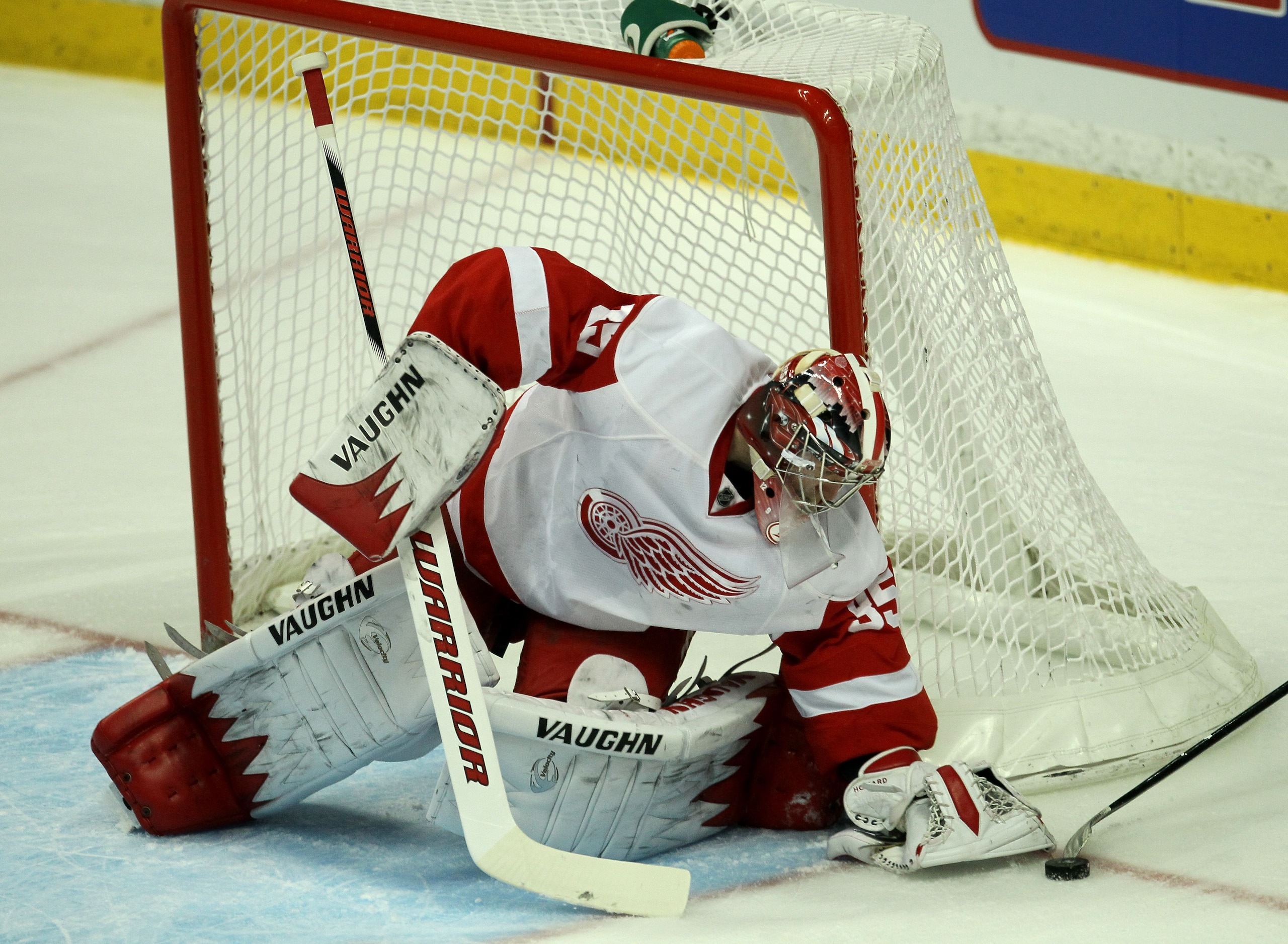 ANAHEIM, CA - MARCH 02:  Goalie Jimmy Howard #35 of the Detroit Red Wings blocks the puck against the Anaheim Ducks on March 2, 2011 at the Honda Center in Anaheim, California. The Ducks won 2-1 in overtime.  (Photo by Stephen Dunn/Getty Images)