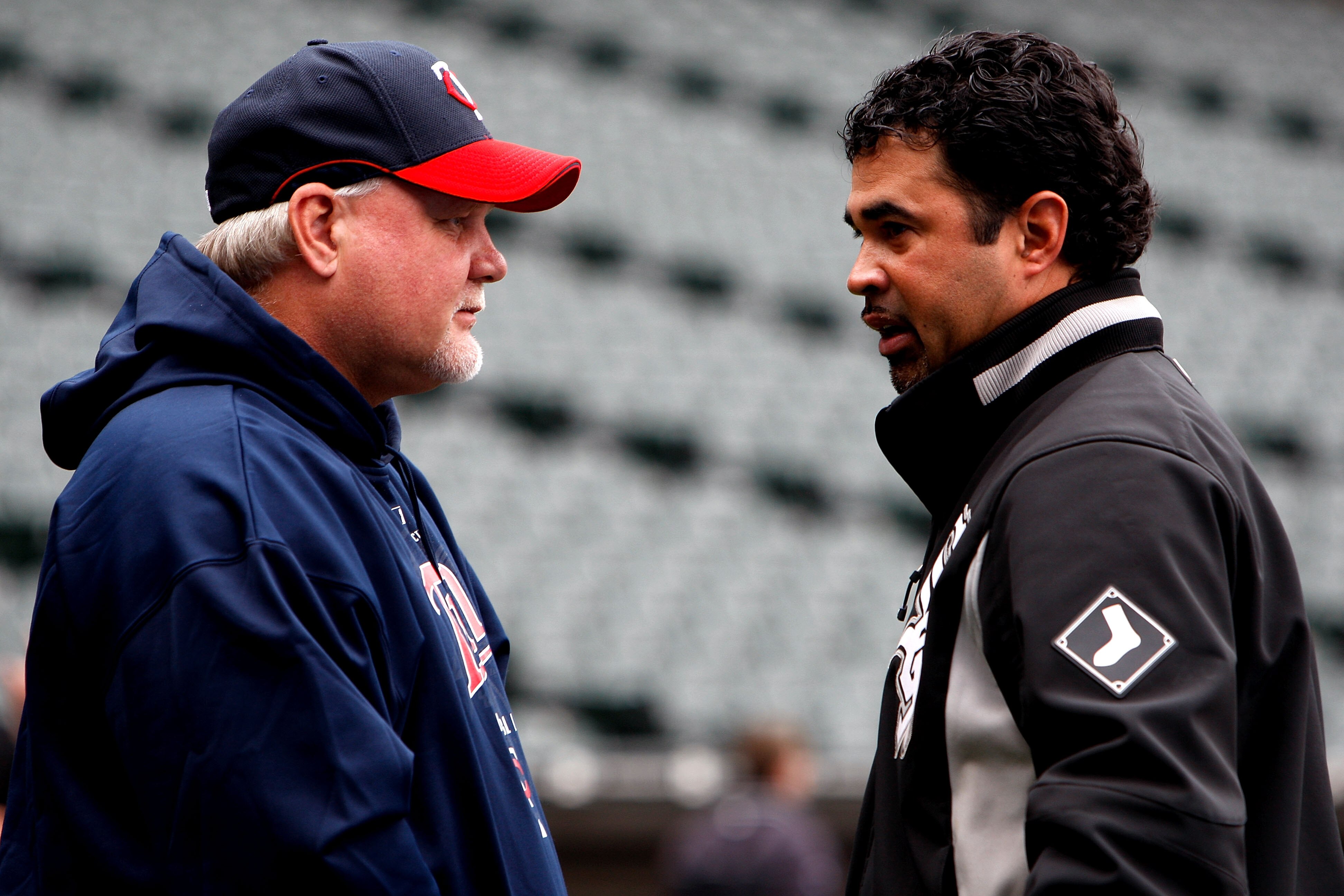 CHICAGO - SEPTEMBER 30:  Manager Ozzie Guillen #13 (R) of the Chicago White Sox and manager Ron Gardenhire #35 of the Minnesota Twins talk during batting practice prior to the American League Central Division Tiebreaker game at U.S. Cellular Field on Sept