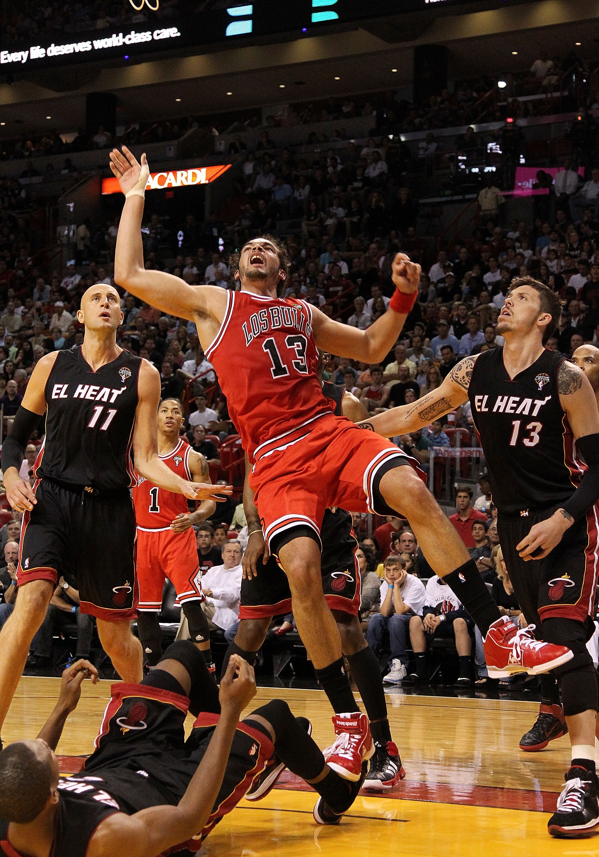 MIAMI, FL - MARCH 06:  Joakim Noah #13 of the Chicago Bulls takes an awkward shot  during a game against the Miami Heat at American Airlines Arena on March 6, 2011 in Miami, Florida. NOTE TO USER: User expressly acknowledges and agrees that, by downloadin