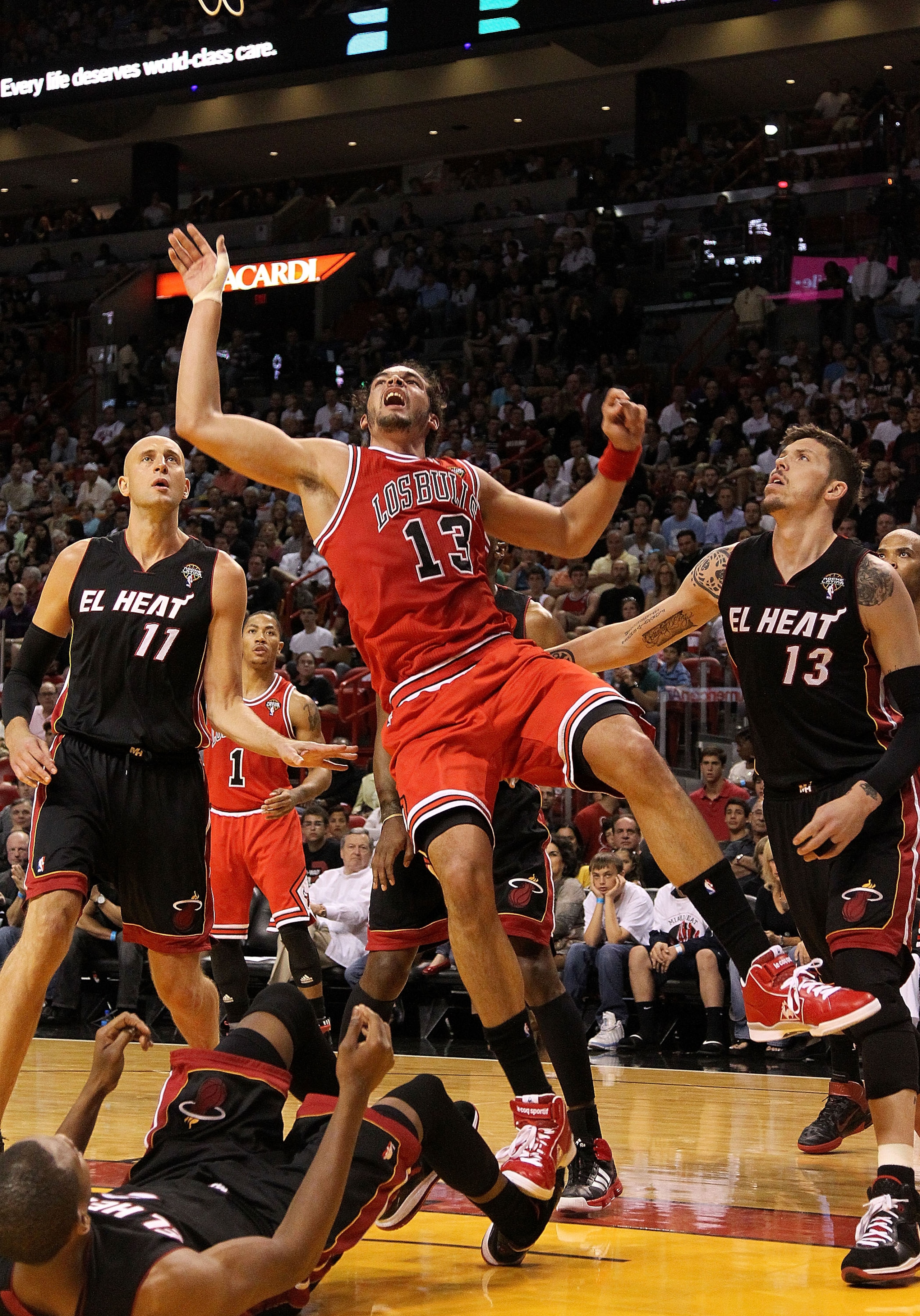MIAMI, FL - MARCH 06:  Joakim Noah #13 of the Chicago Bulls takes an awkward shot  during a game against the Miami Heat at American Airlines Arena on March 6, 2011 in Miami, Florida. NOTE TO USER: User expressly acknowledges and agrees that, by downloadin