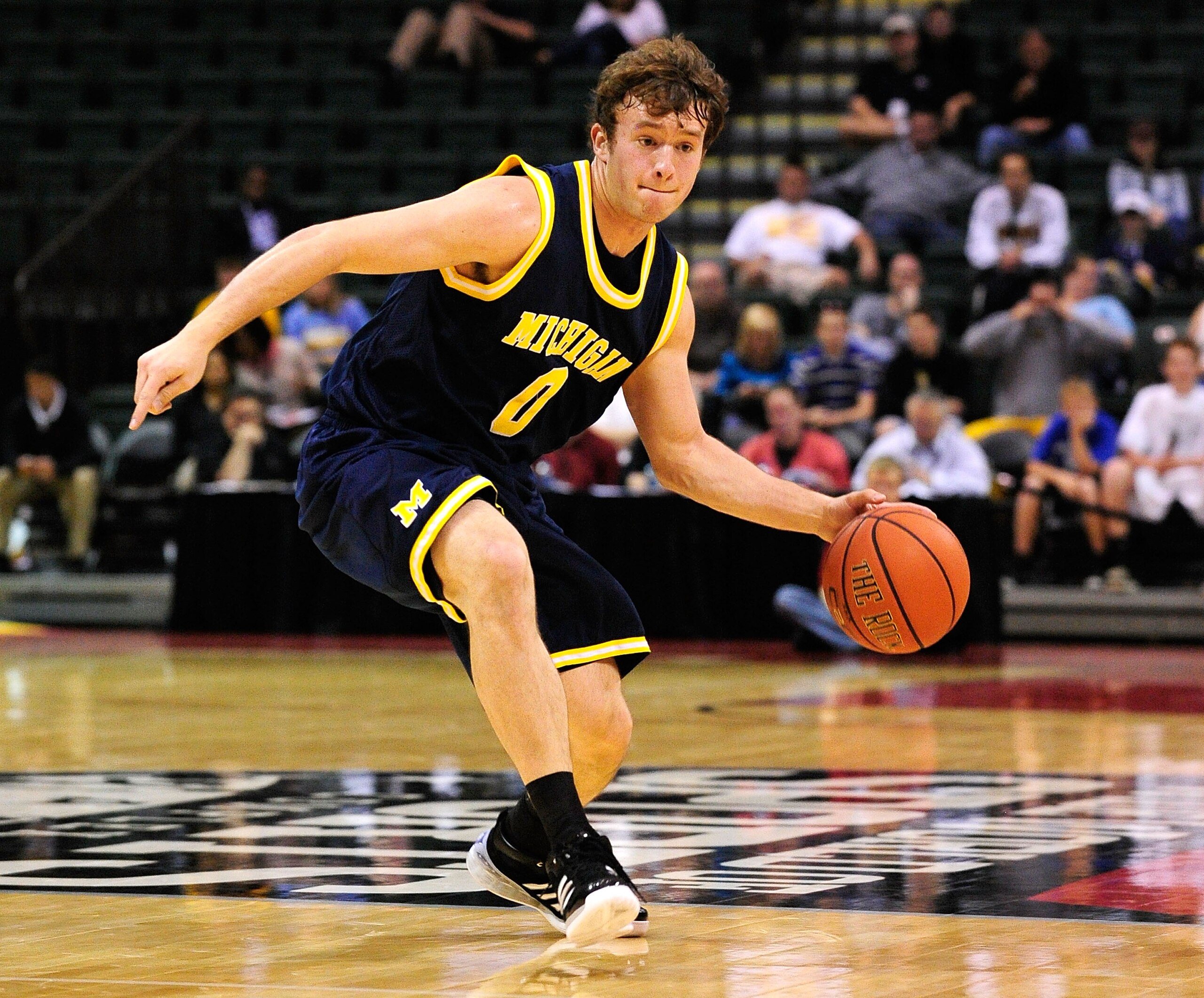 ORLANDO, FL - NOVEMBER 27: Zack Novak #0 of the Michigan Wolverines attempts a pass against the Marquette Golden Eagles during the Old Spice Classic at Disney's Milk House on November 27, 2009 in Orlando, Florida. Marquette defeated Michigan 79-65. (Pho ORLANDO, FL - NOVEMBER 27: Zack Novak #0 of the Michigan Wolverines attempts a pass against the Marquette Golden Eagles during the Old Spice Classic at Disney's Milk House on November 27, 2009 in Orlando, Florida. Marquette defeated Michigan 79-65. (Pho