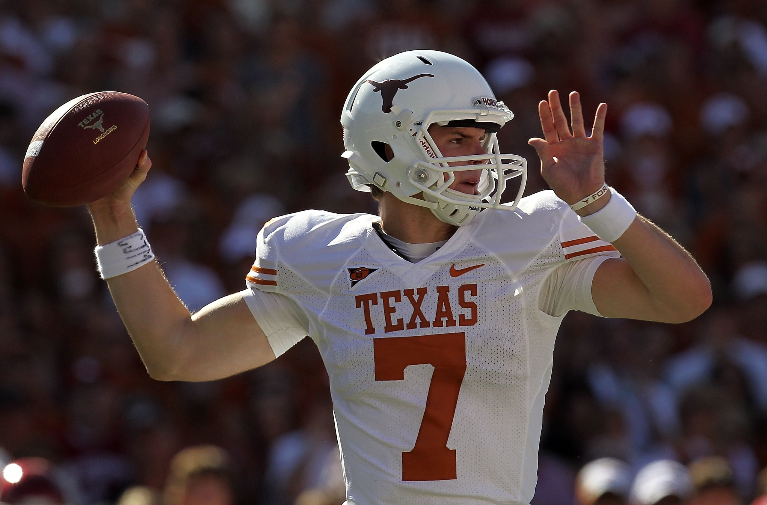 DALLAS - OCTOBER 02: Quarterback Garrett Gilbert #7 of the Texas Longhorns drops back to pass against the Oklahoma Sooners in the second quarter at the Cotton Bowl on October 2, 2010 in Dallas, Texas. (Photo by Ronald Martinez/Getty Images) DALLAS - OCTOBER 02: Quarterback Garrett Gilbert #7 of the Texas Longhorns drops back to pass against the Oklahoma Sooners in the second quarter at the Cotton Bowl on October 2, 2010 in Dallas, Texas. (Photo by Ronald Martinez/Getty Images)