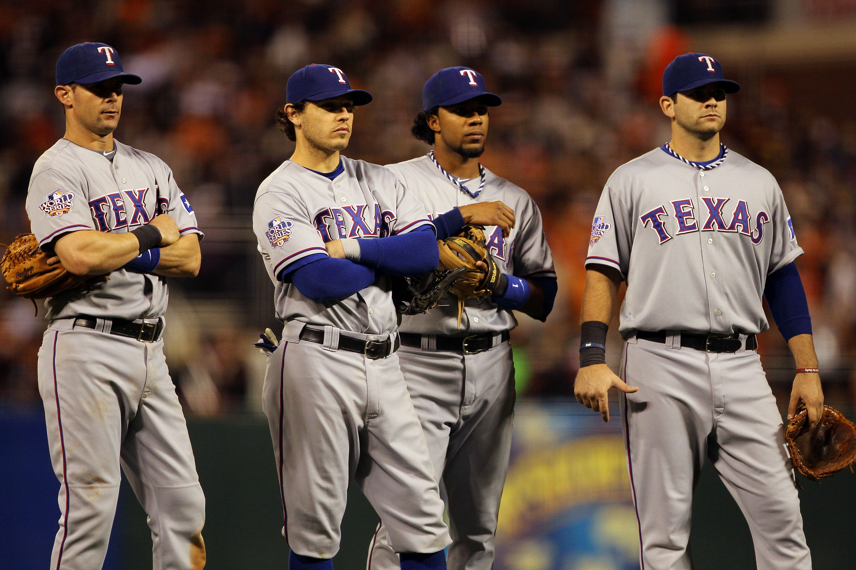 SAN FRANCISCO - OCTOBER 28:  (L-R) Michael Young #10, Ian Kinsler #5, Elvis Andrus #1 and Mitch Moreland #18 of the Texas Rangers stand together during a pitching change in the seventh inning while taking on the San Francisco Giants in Game Two of the 201