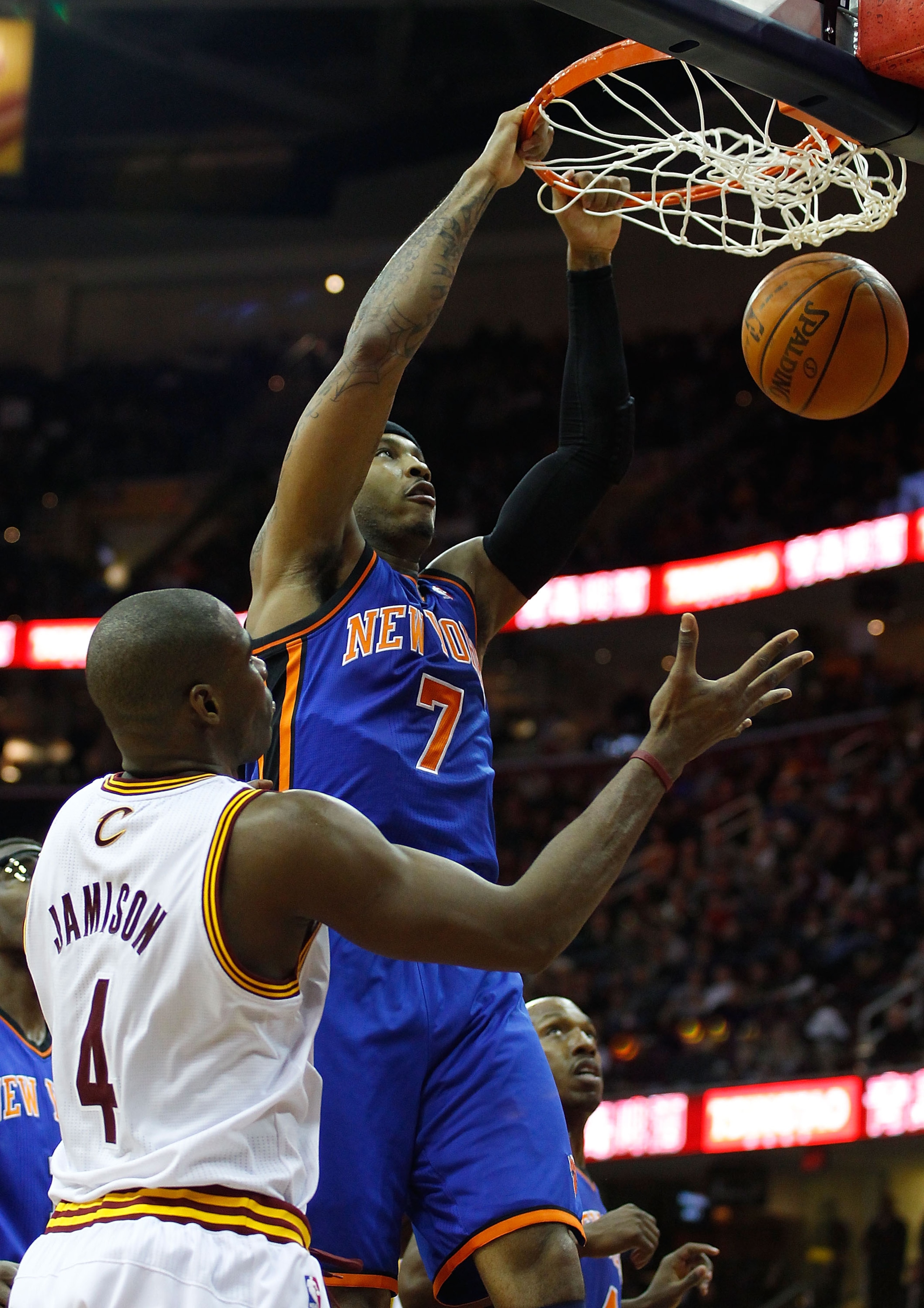 CLEVELAND - FEBRUARY 25:  Carmelo Anthony #7 of the New York Knicks dunks the ball in front of Antawn Jamison #4 of the Cleveland Cavaliers during the game on February 25, 2011 at Quicken Loans Arena in Cleveland, Ohio. NOTE TO USER: User expressly acknow
