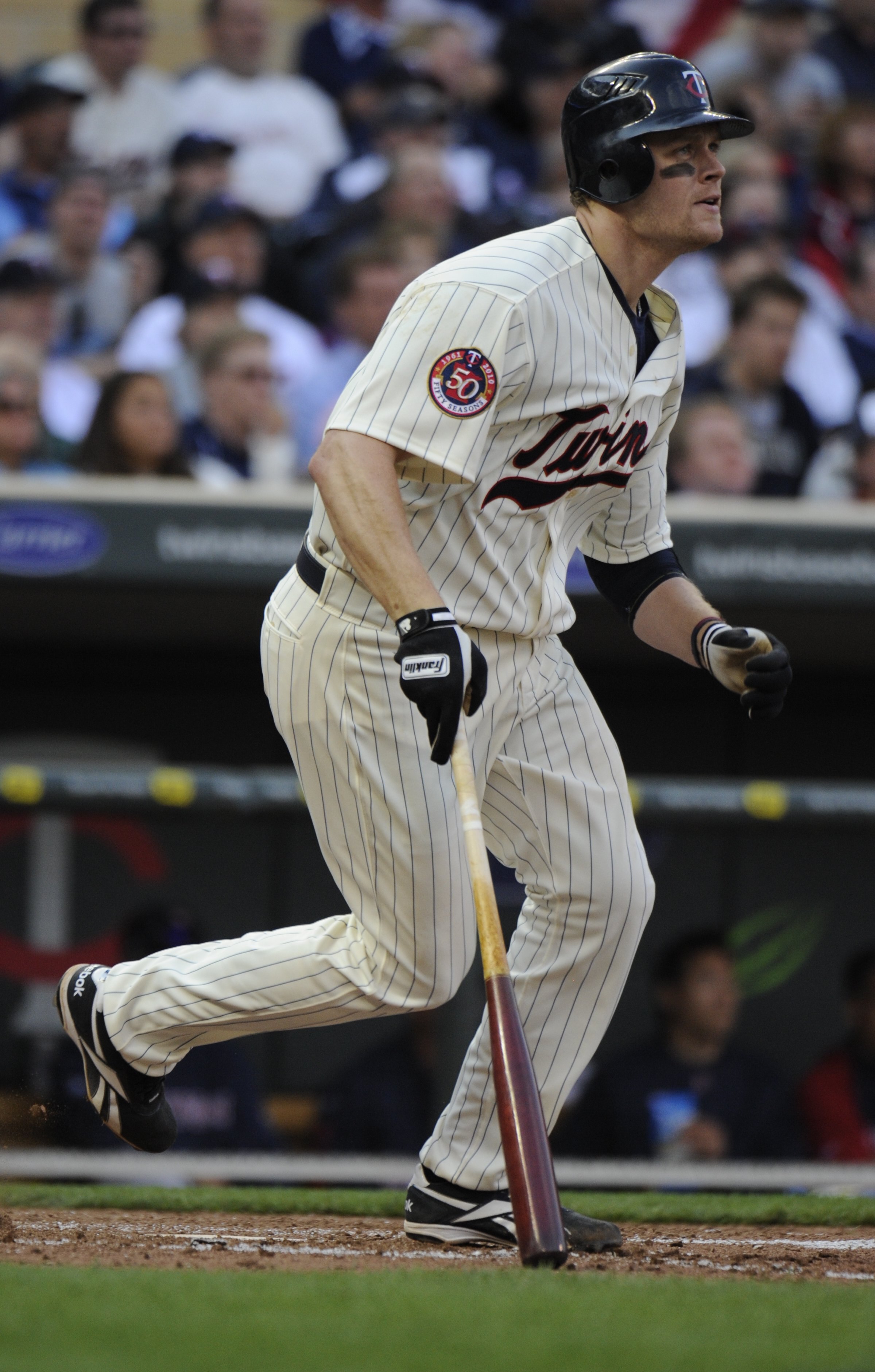 MINNEAPOLIS, MN - APRIL 12: Justin Morneau #33 of the Minnesota Twins runs towards first base in the eighth inning against the Boston Red Sox during the Twins home opener at Target Field on April 12, 2010 in Minneapolis, Minnesota. (Photo by Hannah Foslie
