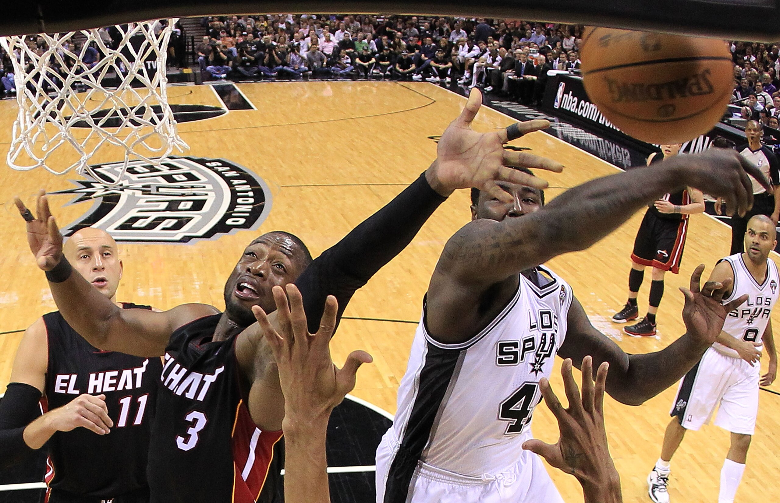SAN ANTONIO, TX - MARCH 04:  Forward DeJuan Blair #45 of the San Antonio Spurs blocks a shot by Dwyane Wade #3 of the Miami Heat at AT&T Center on March 4, 2011 in San Antonio, Texas.   NOTE TO USER: User expressly acknowledges and agrees that, by downloa