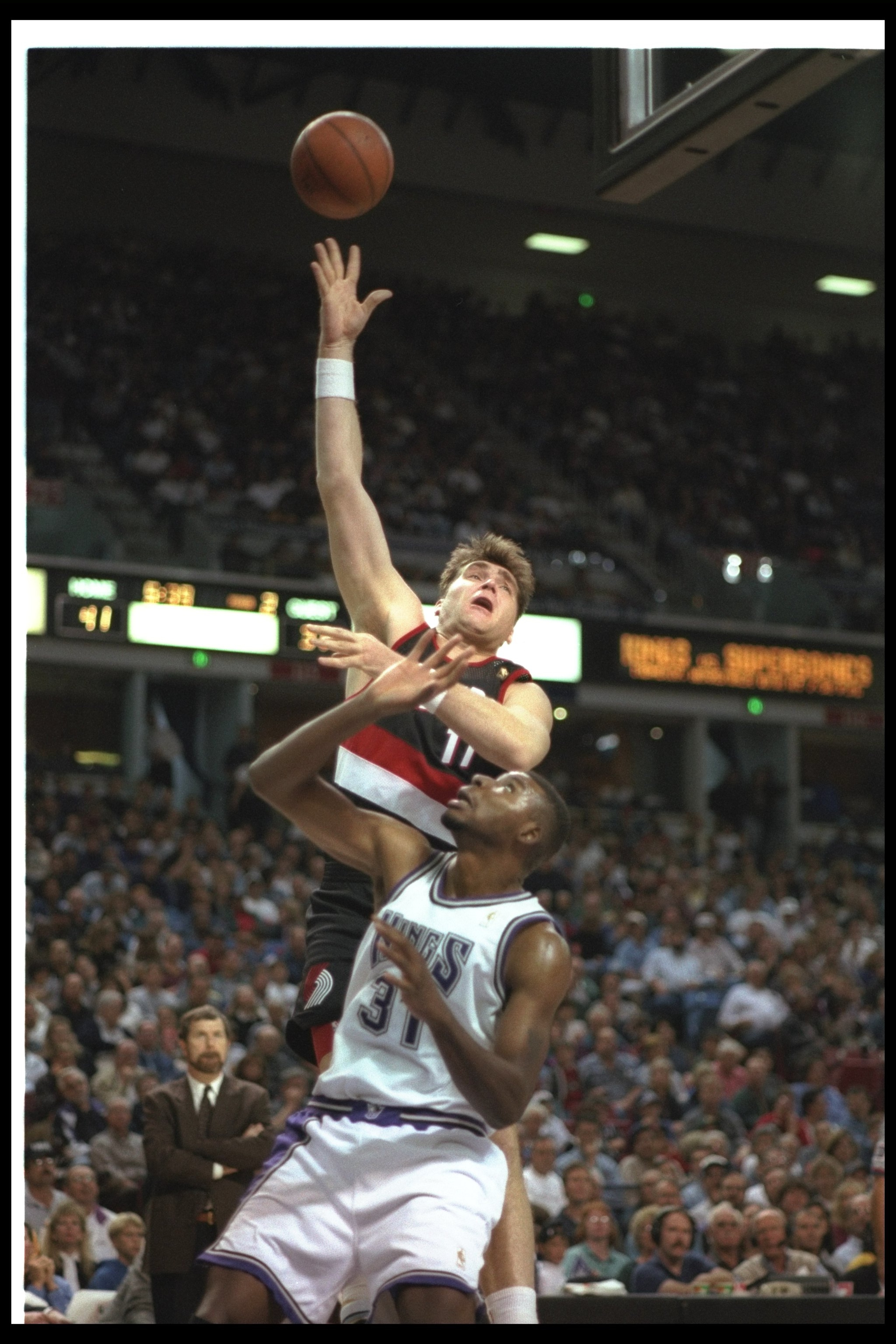 9 Nov 1996: Center Arvydas Sabonis of the Portland Trailblazers (left) goes up for two during a game against the Sacramento Kings at the ARCO Arena in Sacramento, California. The Kings won the game, 103-102.