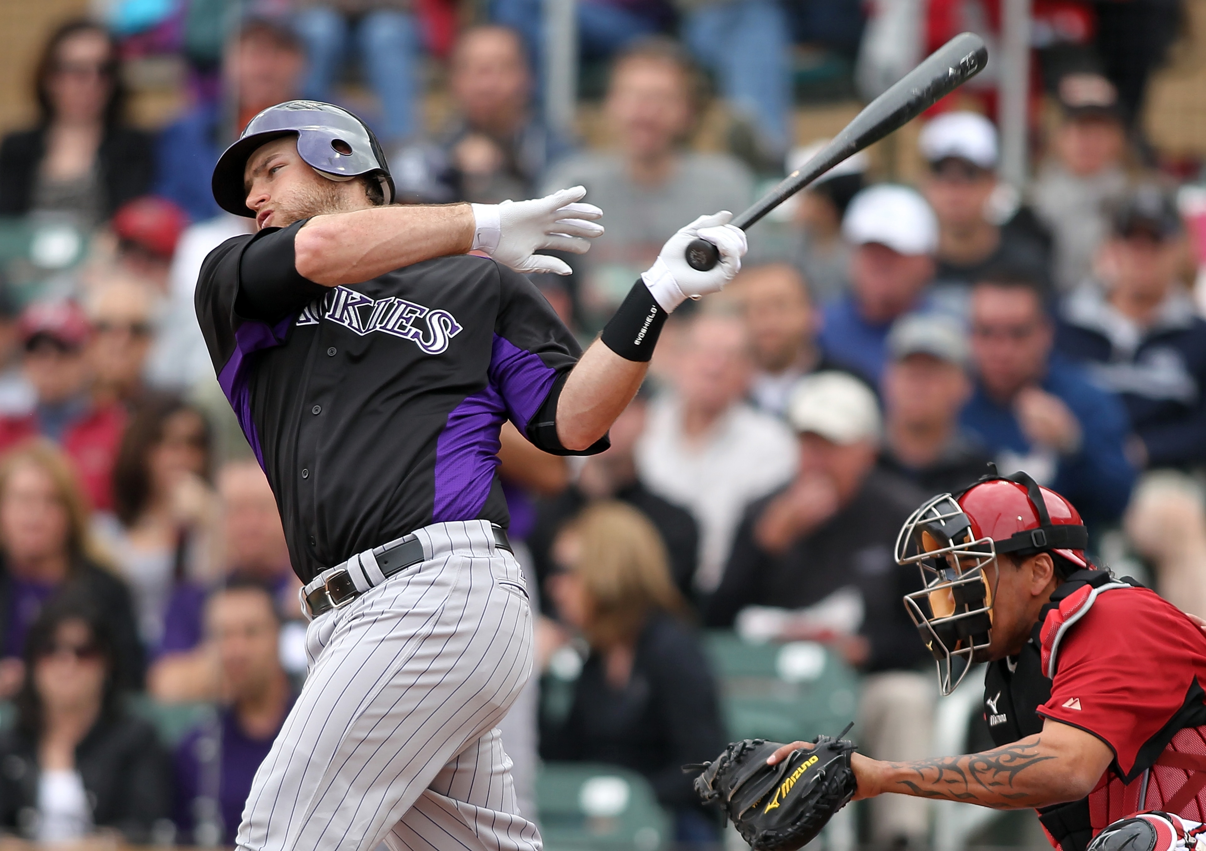 SCOTTSDALE, AZ - FEBRUARY 26:  Chris Iannetta #20 of the Colorado Rockies swings against the game against the Arizona Diamondbacks at Salt River Fields on February 26, 2011in Scottsdale, Arizona..  (Photo by Jonathan Ferrey/Getty Images)