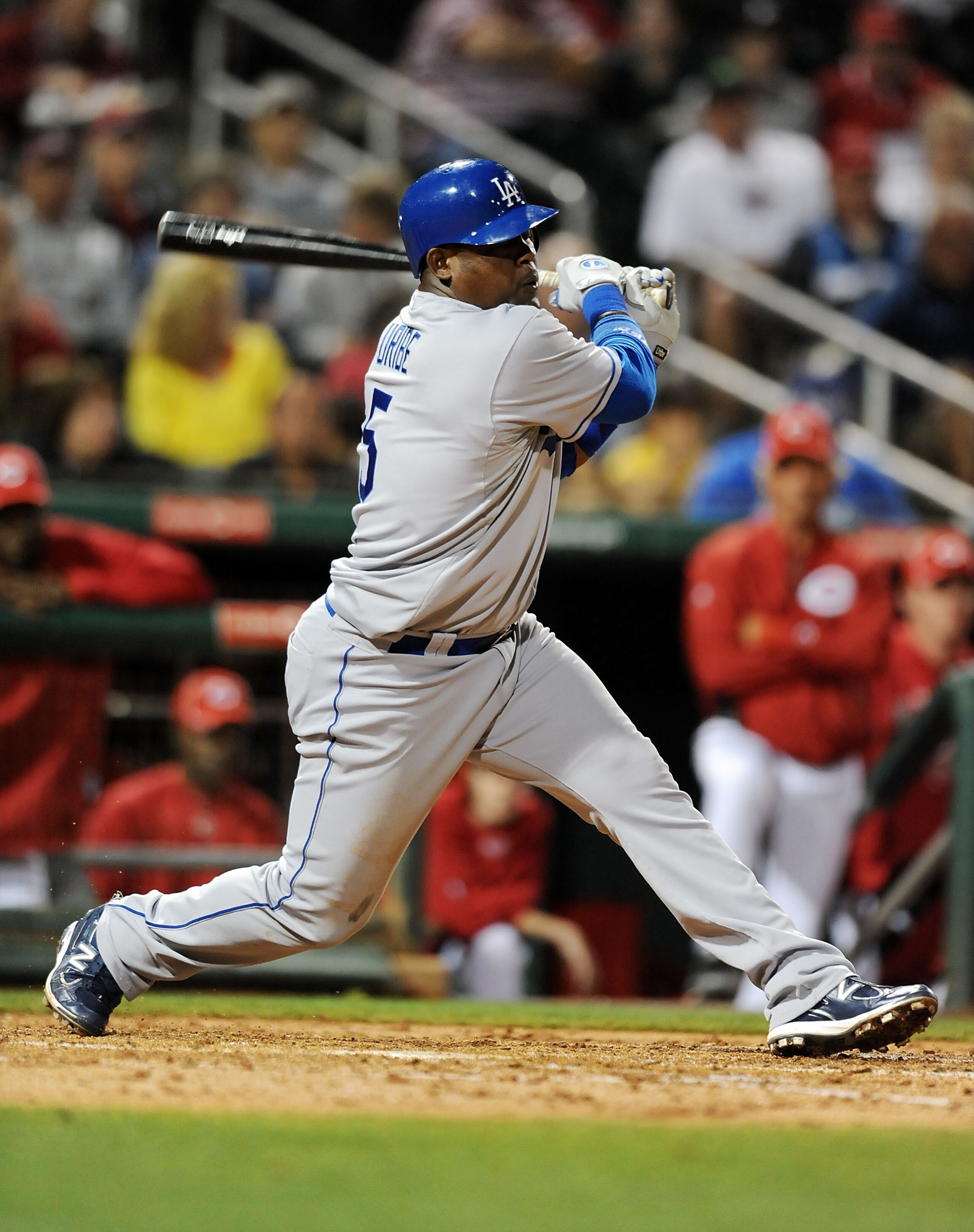 GOODYEAR, AZ - MARCH 03:  Juan Uribe #5 of the Los Angeles Dodgers follows through on a swing against the Cincinnati Reds at Goodyear Ballpark on March 3, 2011 in Goodyear, Arizona.  (Photo by Norm Hall/Getty Images)