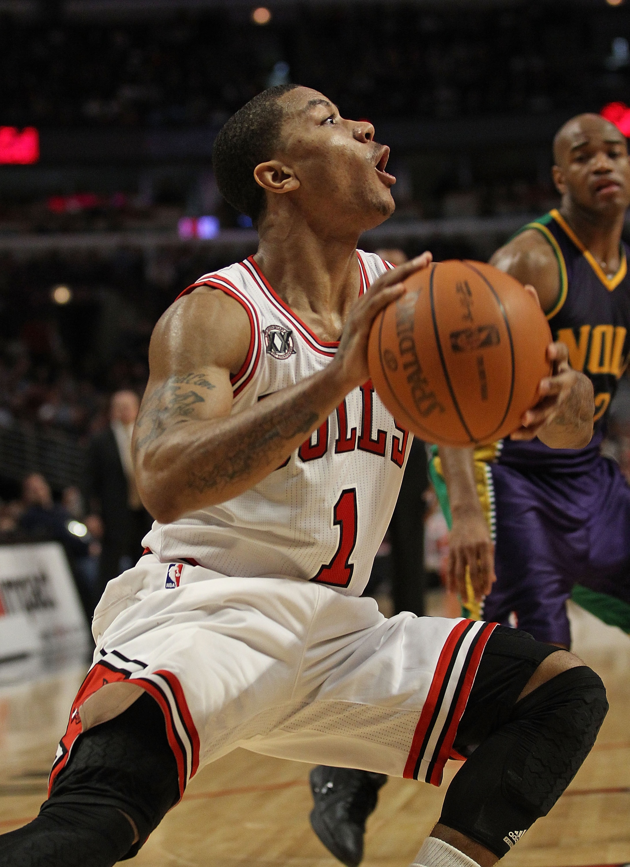 CHICAGO, IL - MARCH 07: Derrick Rose #1 of the Chicago Bulls moves to the basket against the New Orleans Hornets at the United Center on March 7, 2011 in Chicago, Illinois. The Bulls defeated the Hornets 85-77. NOTE TO USER: User expressly acknowledges an CHICAGO, IL - MARCH 07: Derrick Rose #1 of the Chicago Bulls moves to the basket against the New Orleans Hornets at the United Center on March 7, 2011 in Chicago, Illinois. The Bulls defeated the Hornets 85-77. NOTE TO USER: User expressly acknowledges an