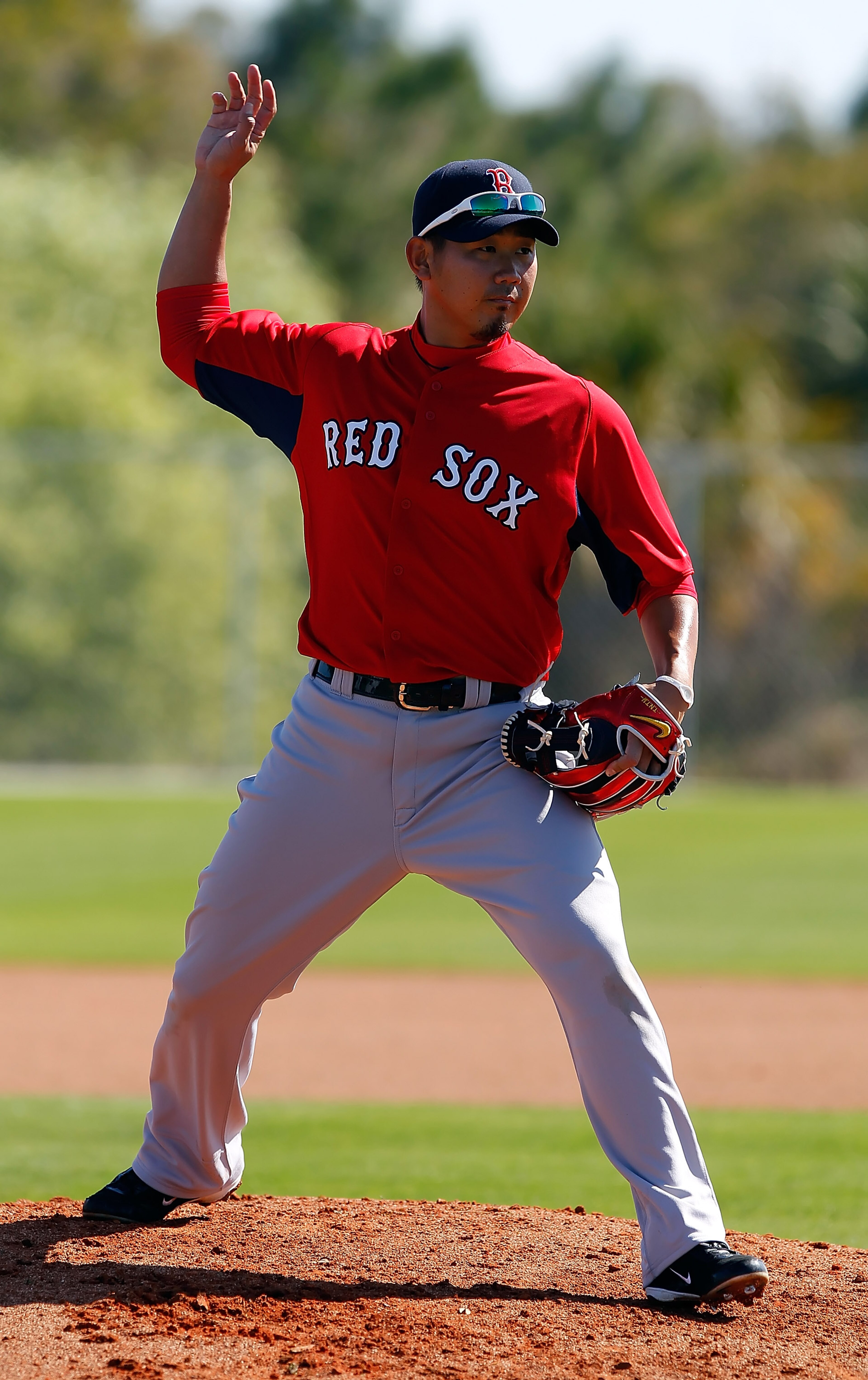 FORT MYERS, FL - FEBRUARY 19:  Pitcher Daisuke Matsuzaka #18 of the Boston Red Sox participates in a drill during a Spring Training Workout Session at the Red Sox Player Development Complex on February 19, 2011 in Fort Myers, Florida.  (Photo by J. Meric/